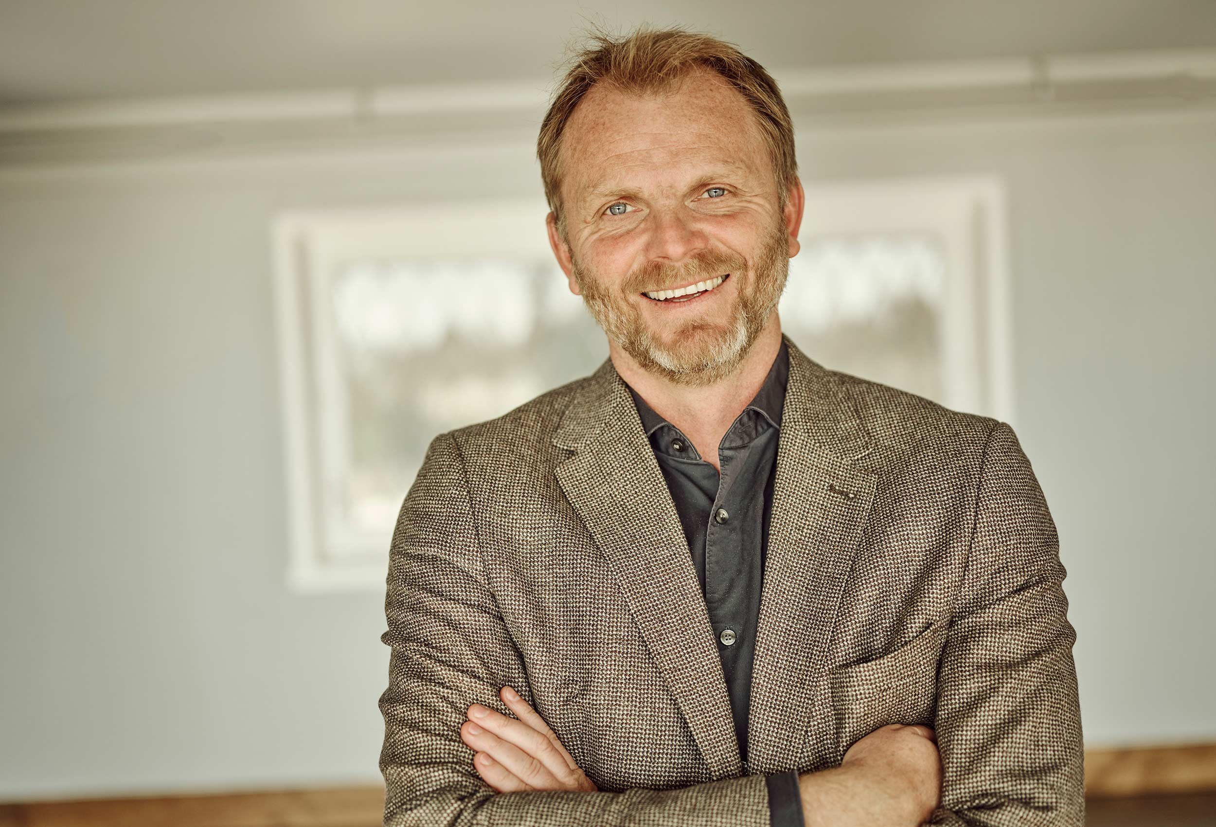 portrait of happy male employee at sola strand hotel and spa
