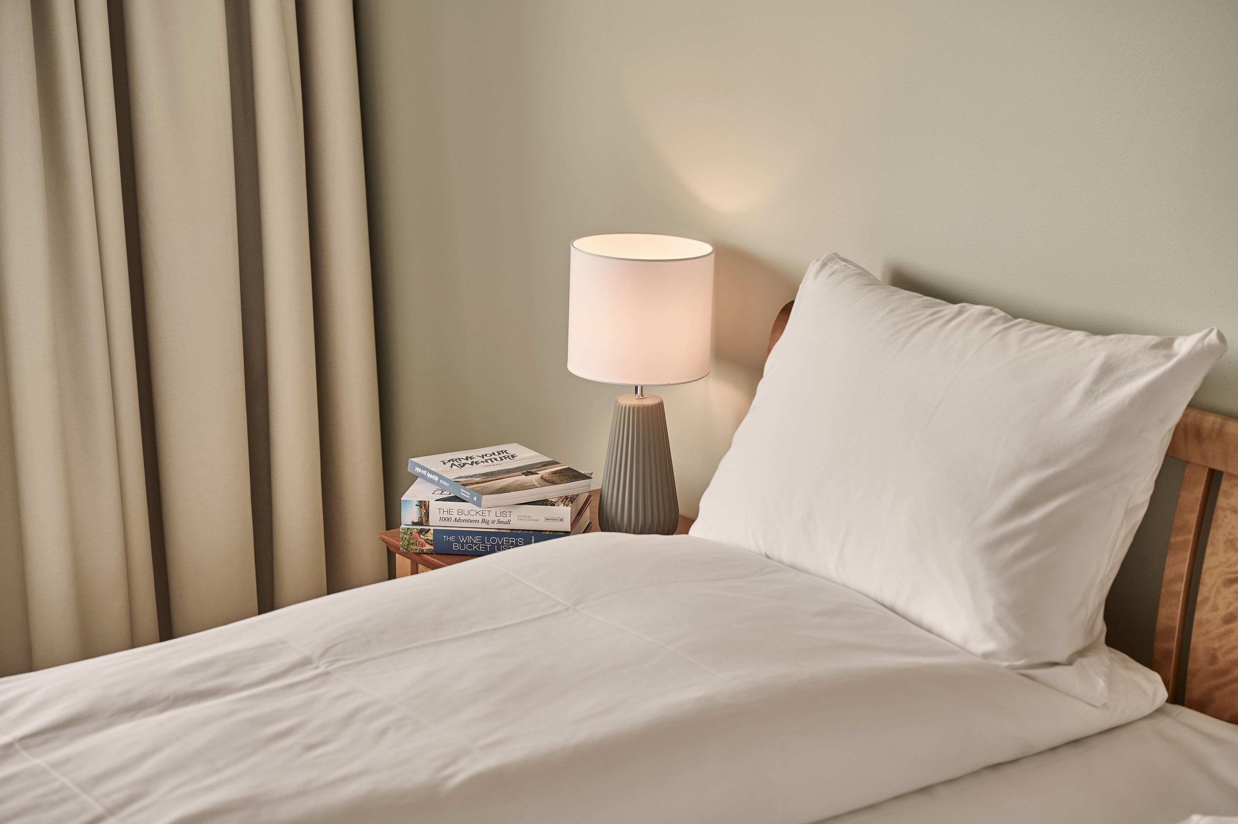 Close-up of a comfortable bed and white linen in a hotel room at Sola Strand Hotel and Spa