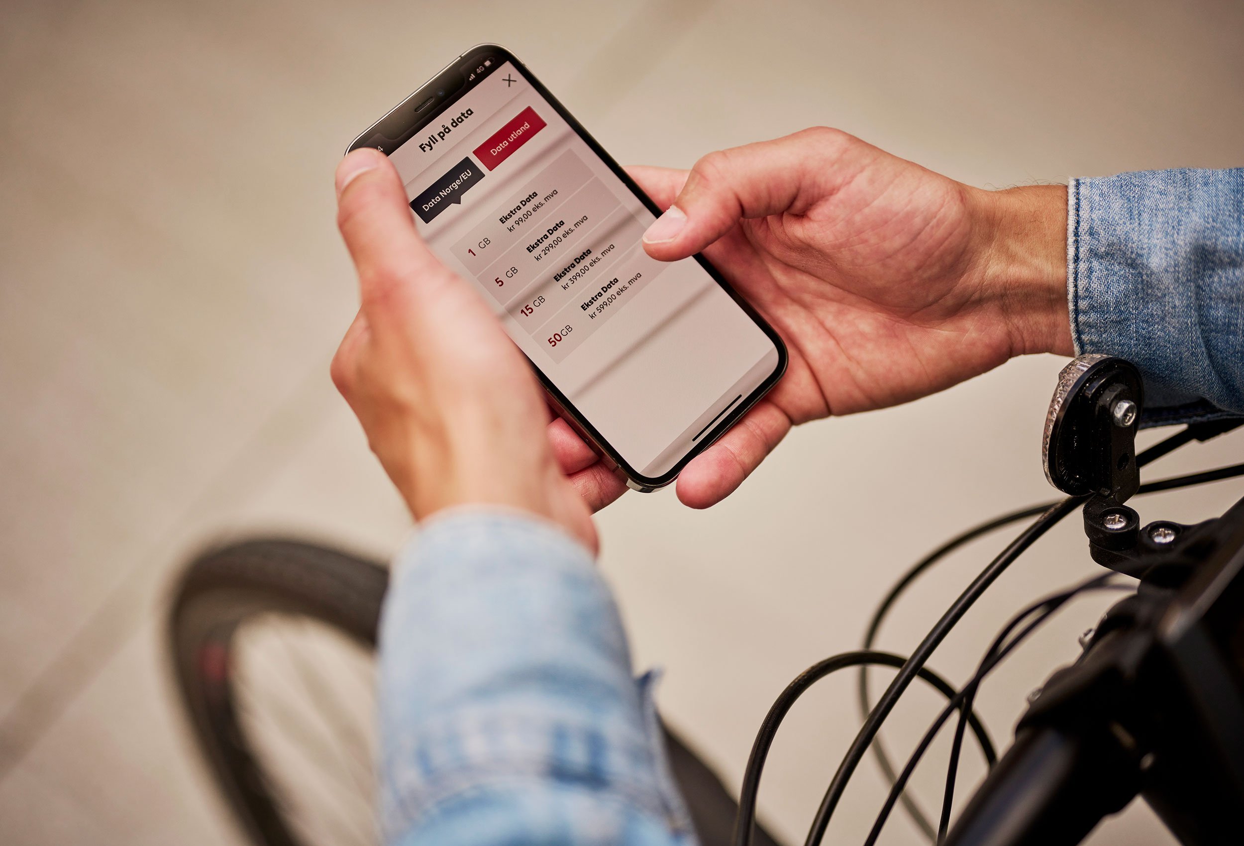 Phonero mobile operator branding video. Close-up man with bike holding phone in commercial portrait photo in Kristiansand Norway.