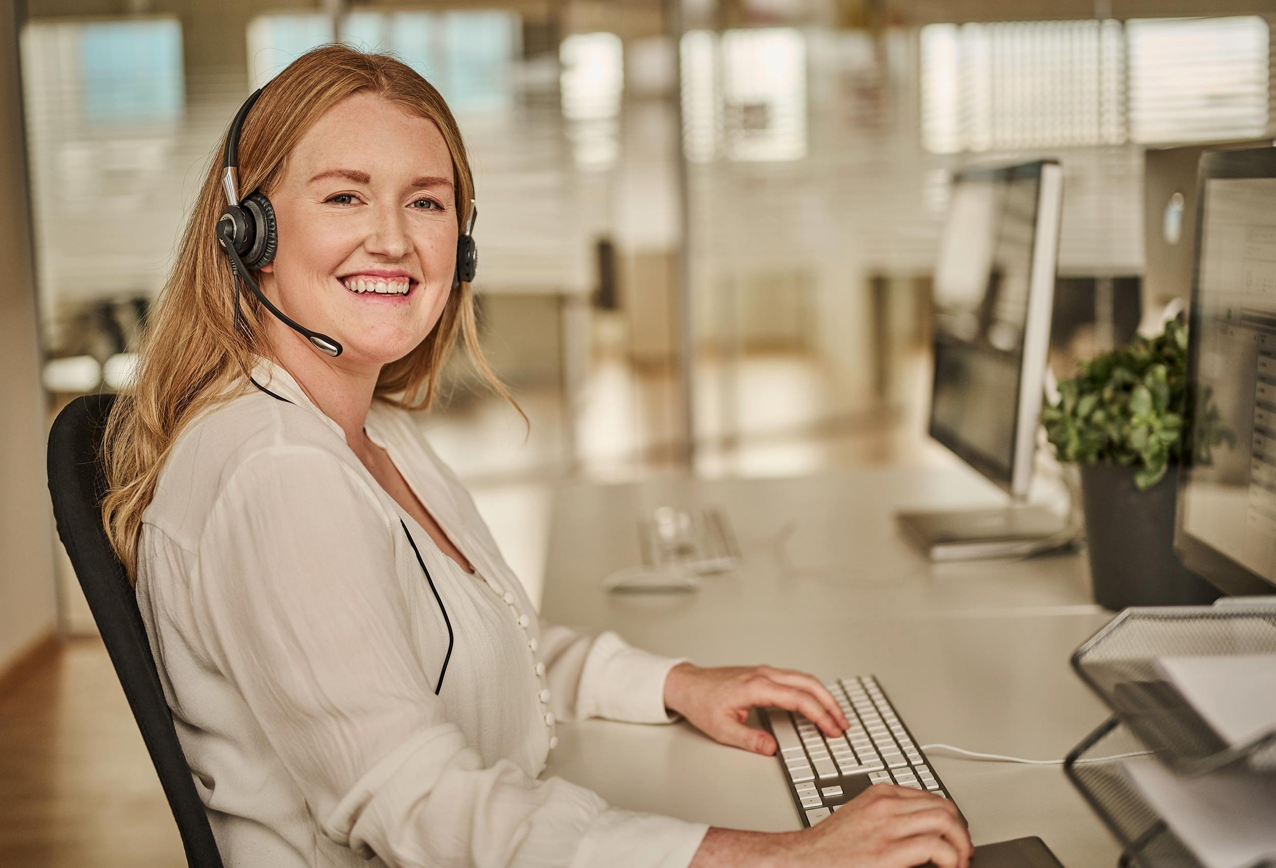 Phonero mobile operator branding video. Female office worker in commercial portrait photo in Kristiansand Norway.