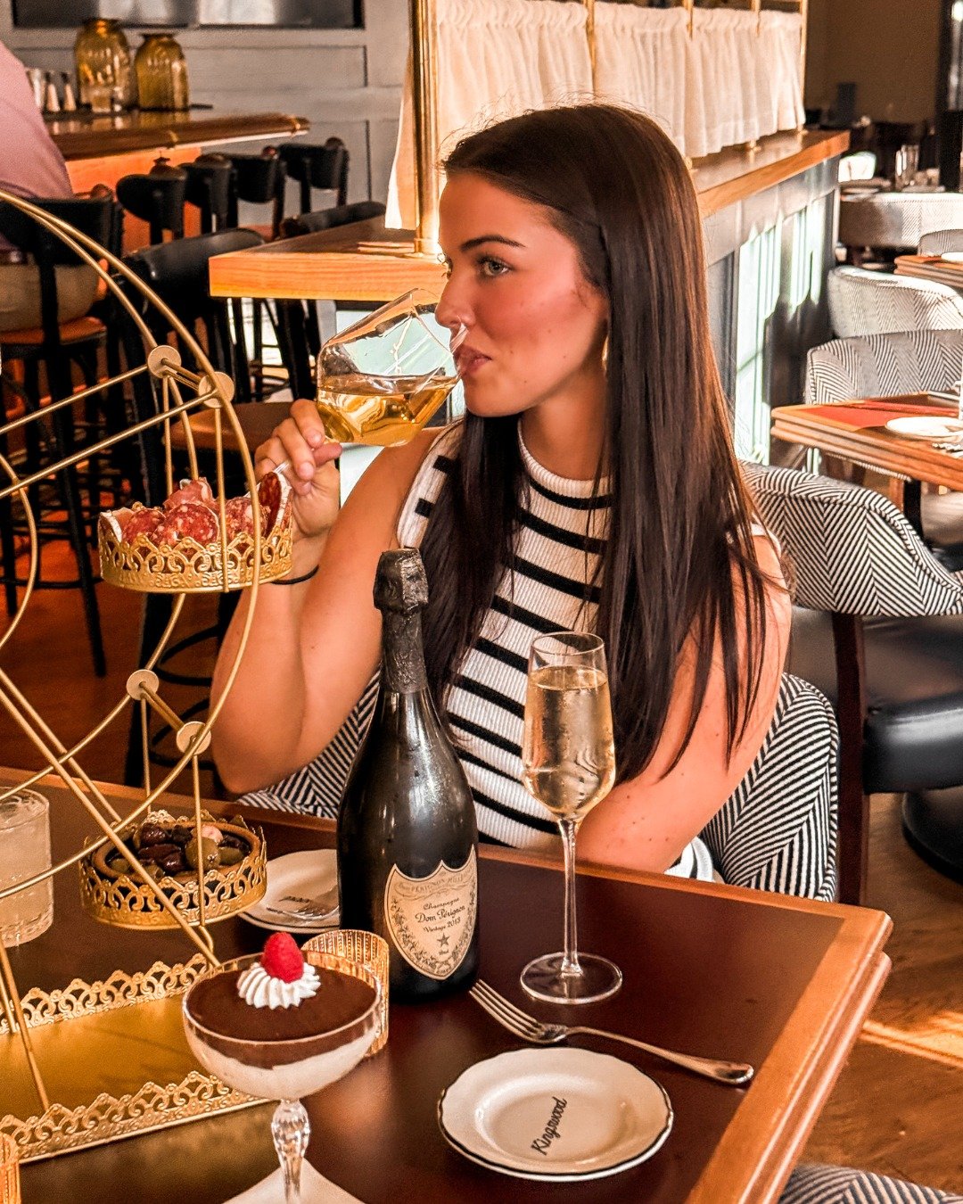 Tucked inside The Oliver, @kingswoodrestaurant is where Oxford unwinds. 
 
Crisp cocktails, polished plates, and a menu tuned to the flavors of the season. Start with The London Eye, a rotating display of curated meats, cheeses, olives, breads, sprea