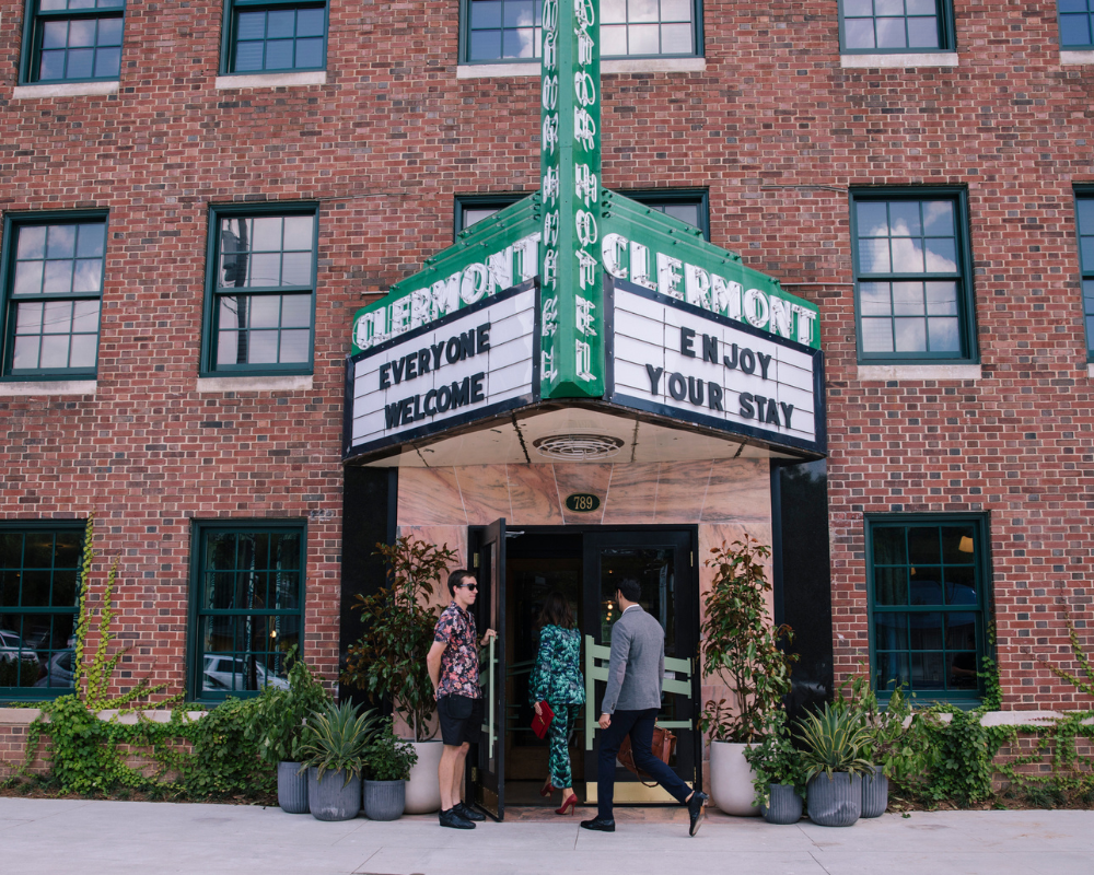 hotel entrance with everyone welcome, enjoy your stay on marquee
