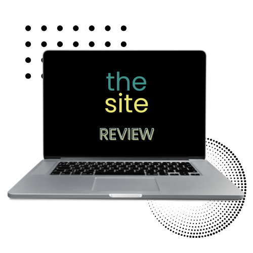 Laptop displaying text 'the site REVIEW' on a black screen.