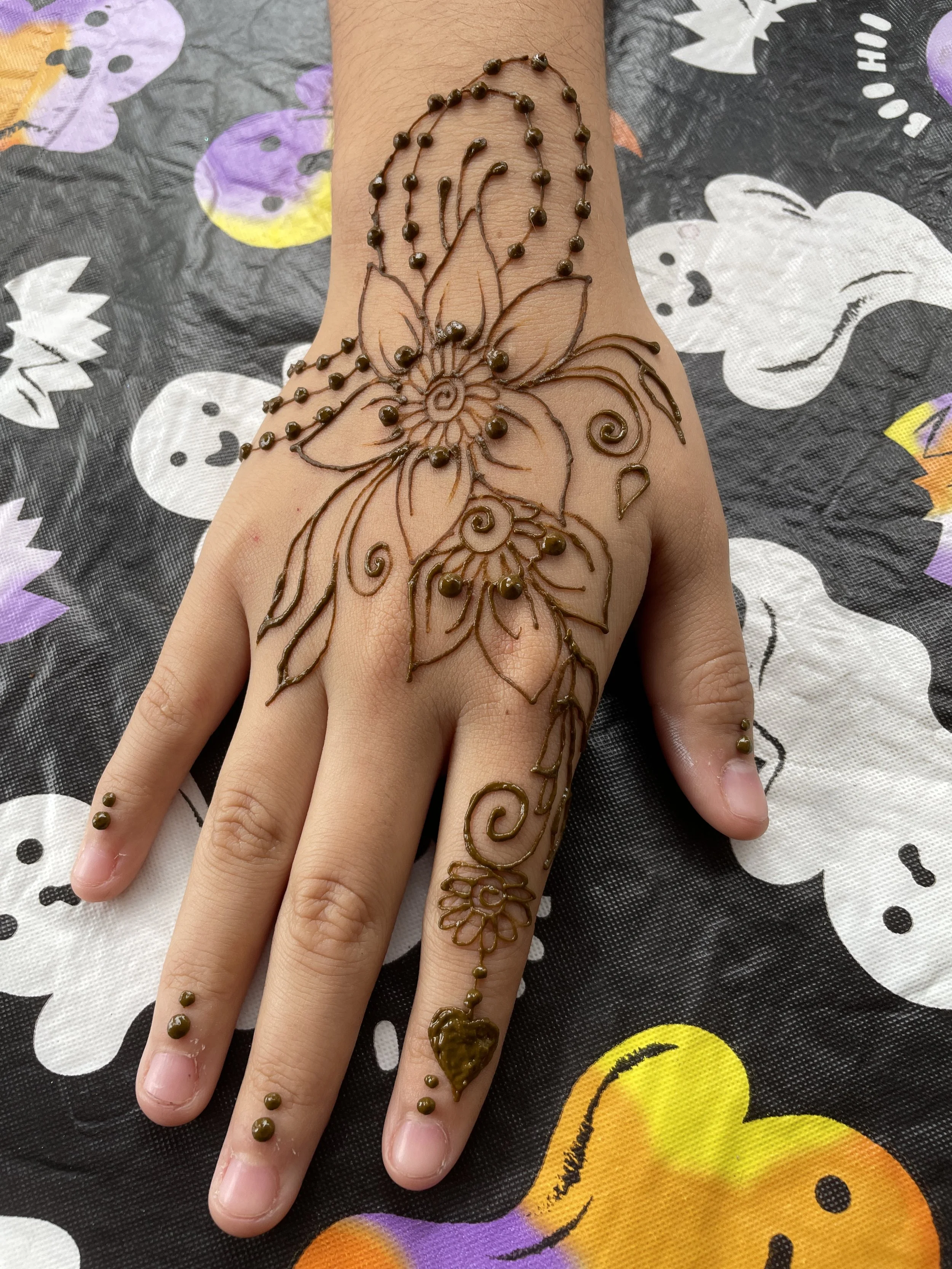 fm wendy flower with dots on hand.JPG