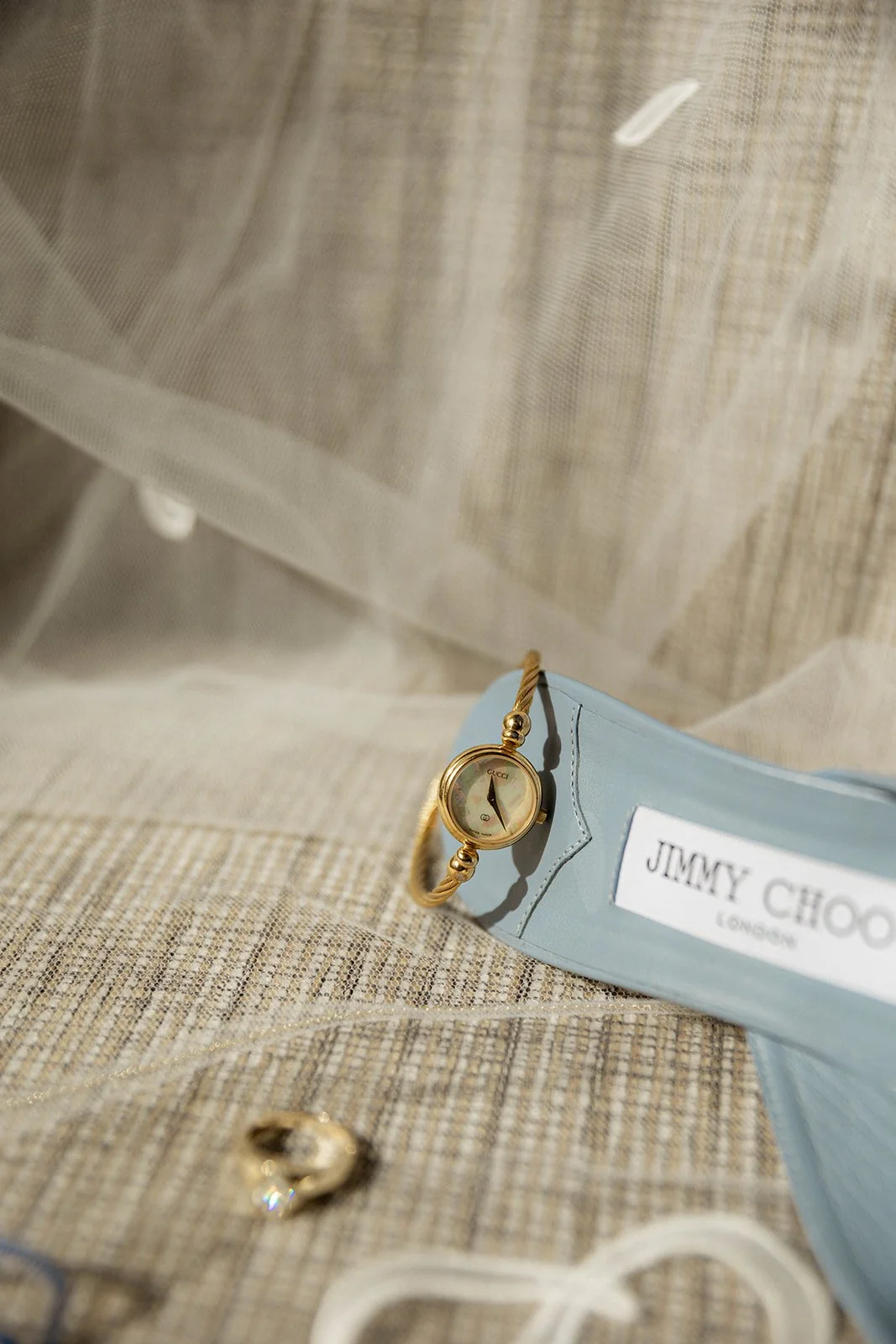 A bride's wedding shoes and wedding jewelry