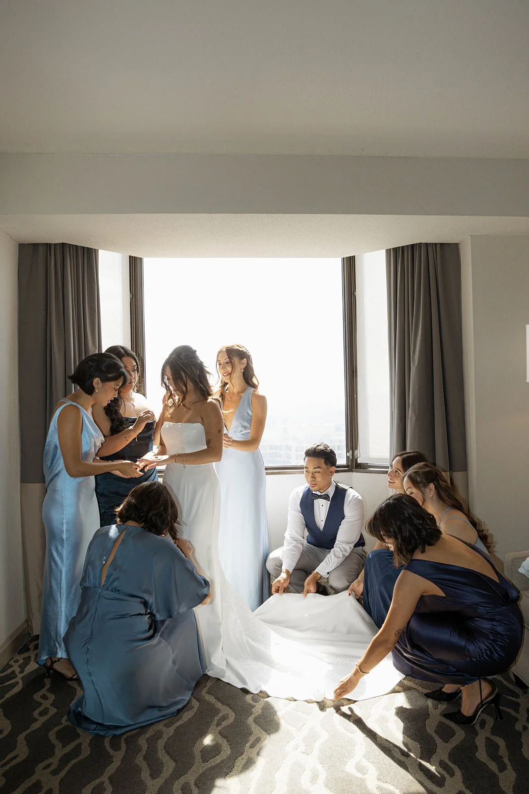 A bride in her getting ready part of her day of wedding timeline