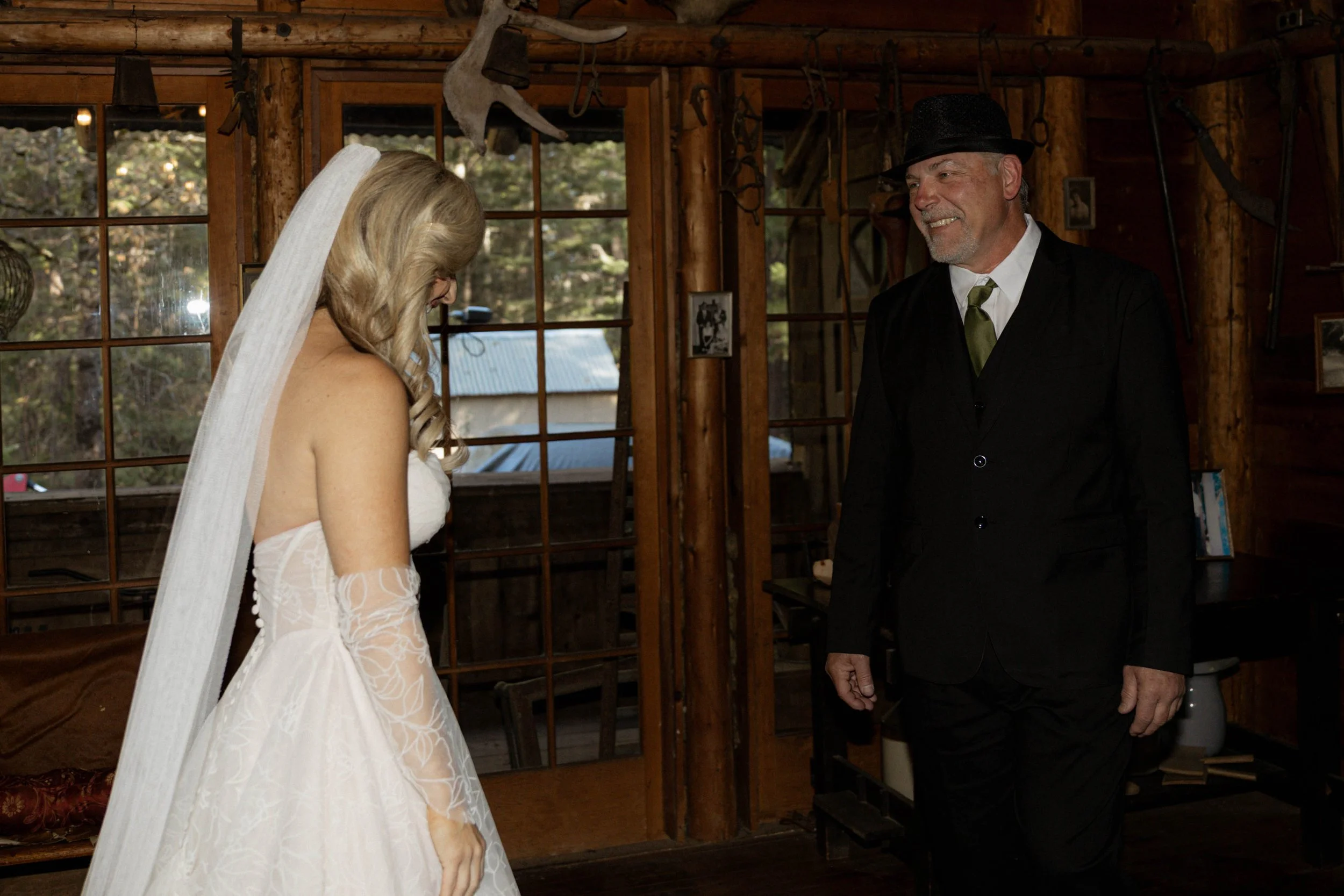 A dad crying during a wedding first look with his daughter