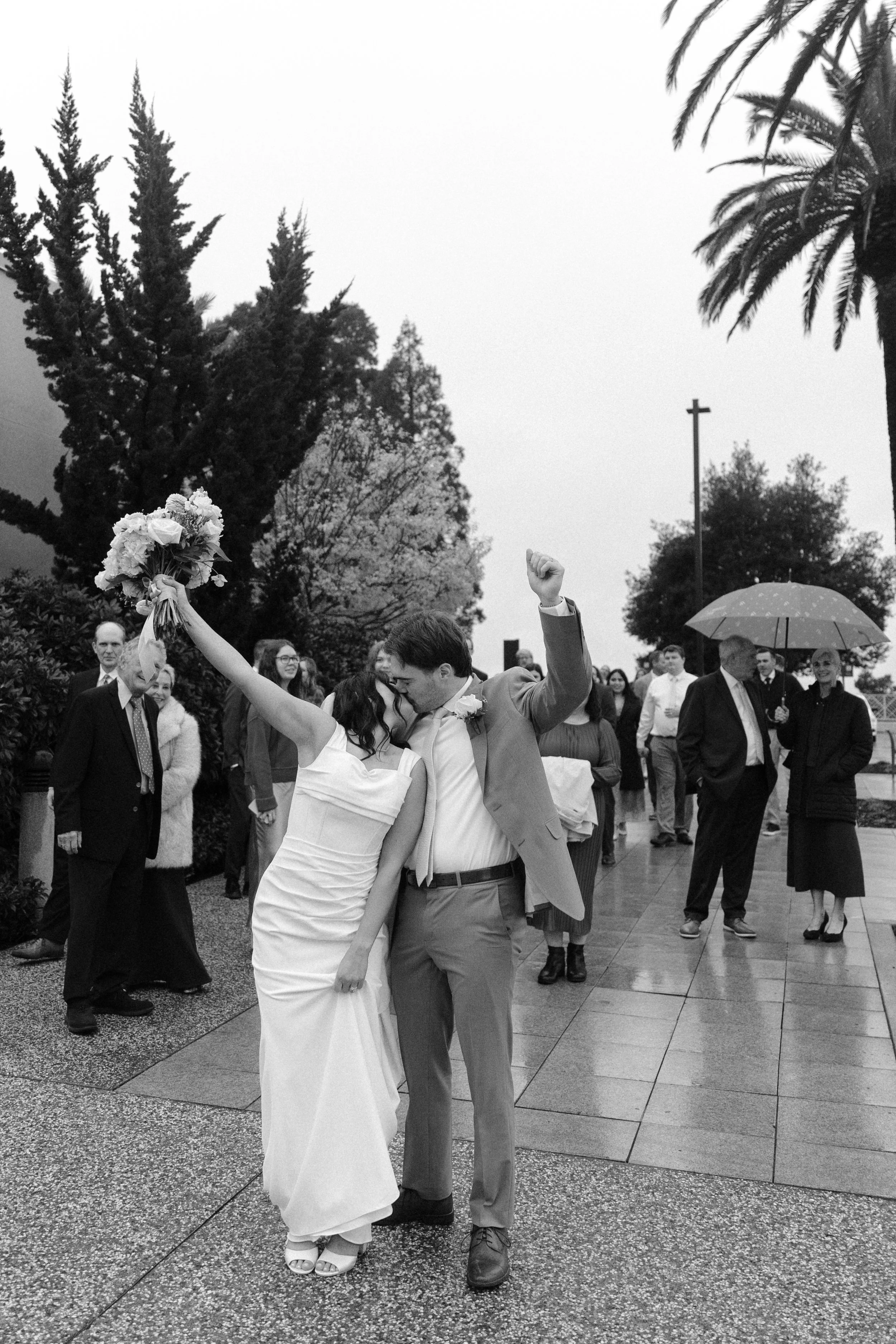 bride and groom share a kiss after their temple wedding in Oakland ca