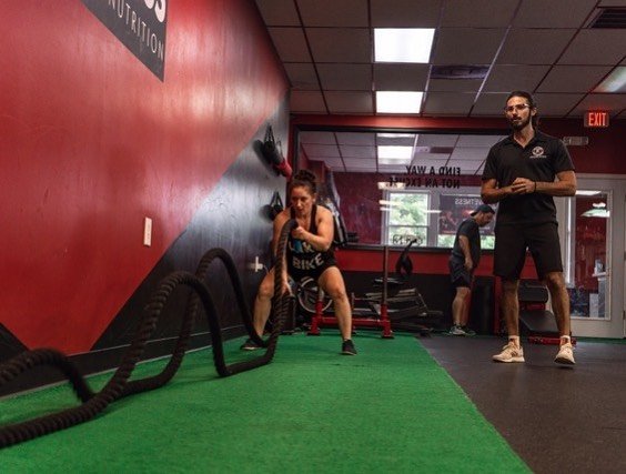 woman doing weighted rope exercises