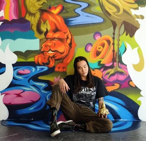 SONG, a Singaporean multidisciplinary artist, expresses his striking visual language through multiple mediums. He is known for his unique style derived from the close exploration of graffiti and its capabilities in mural making, which the artist has 