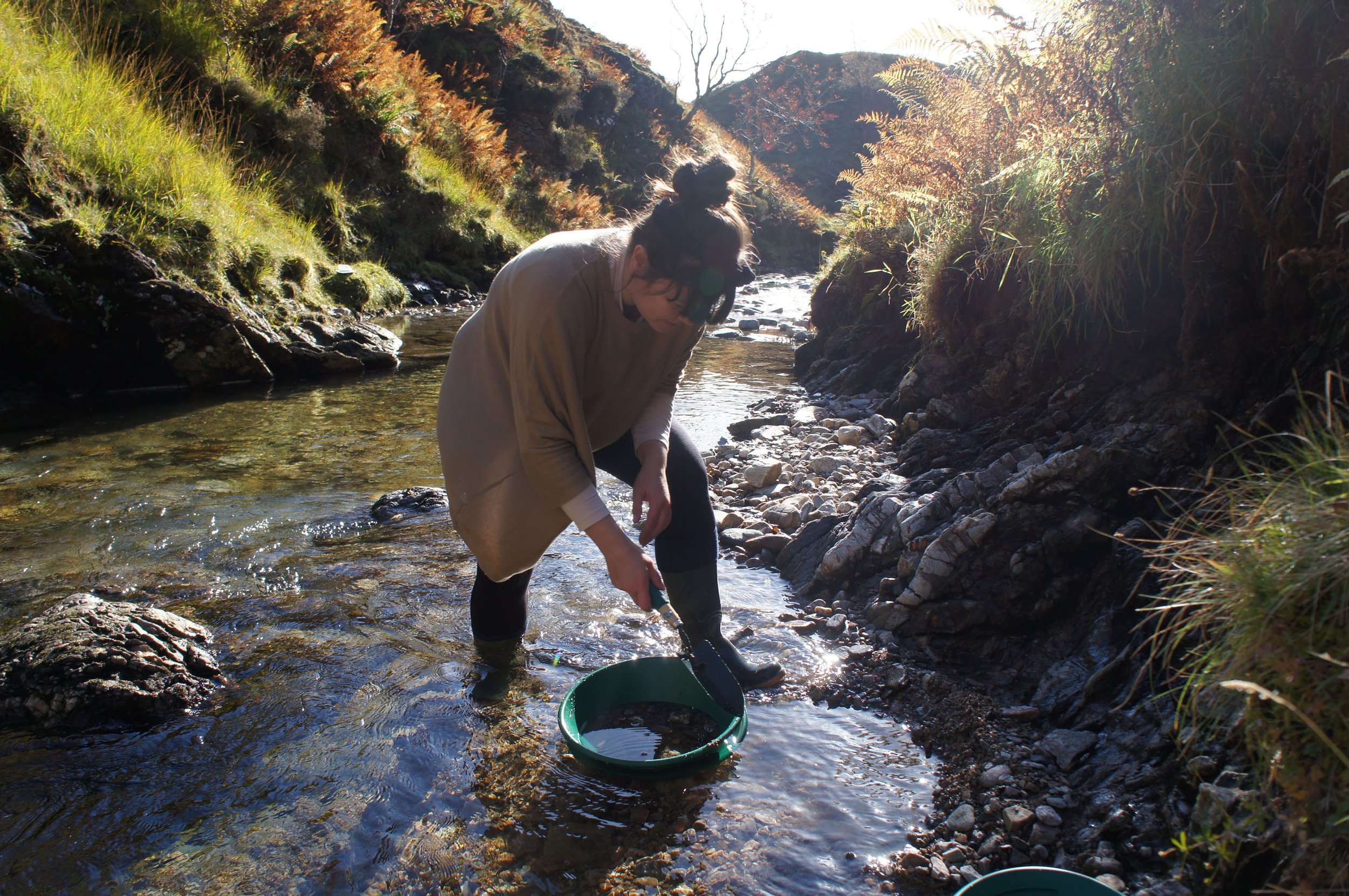 Stefanie Ying Lin Cheong panning for gold in Scottish river. Image credit: Beth Allen