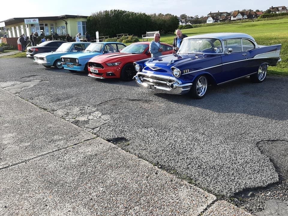 Vintage and modern cars parked in a row  at Roedean Cafe