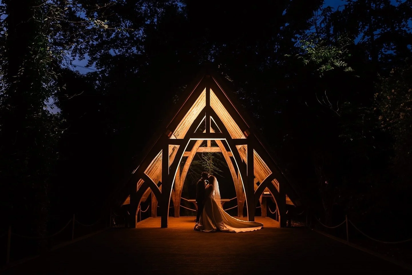 Capturing the magic of love under the enchanting arbor at Rivervale Barn ✨✨ The night cast a beautiful spell as the Jo and Mark embraced, creating a timeless moment. Their love illuminated the darkness, making this picture a centrepiece . 💖💍 #Weddi
