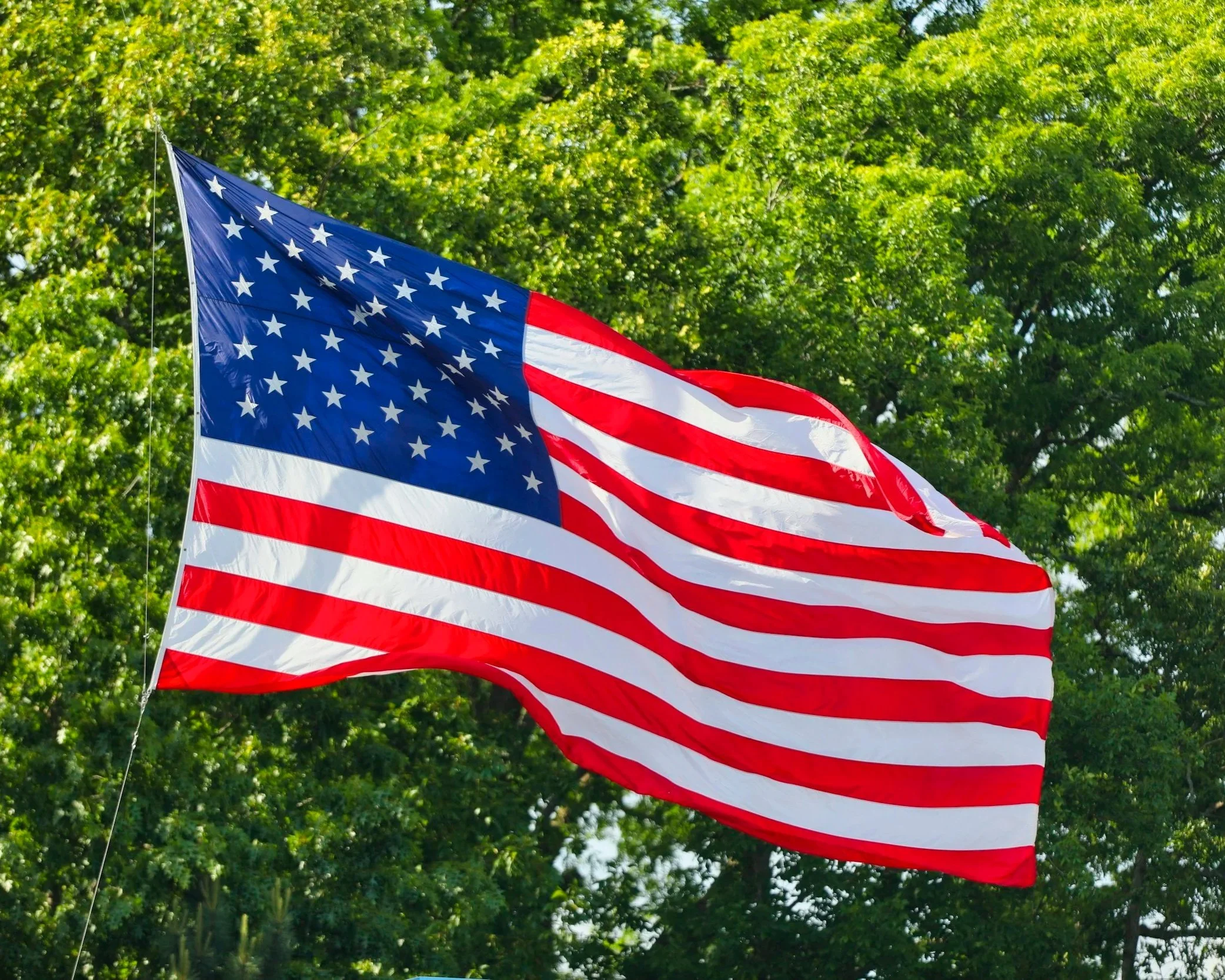 Flag flying in the breeze on the 4th of July.