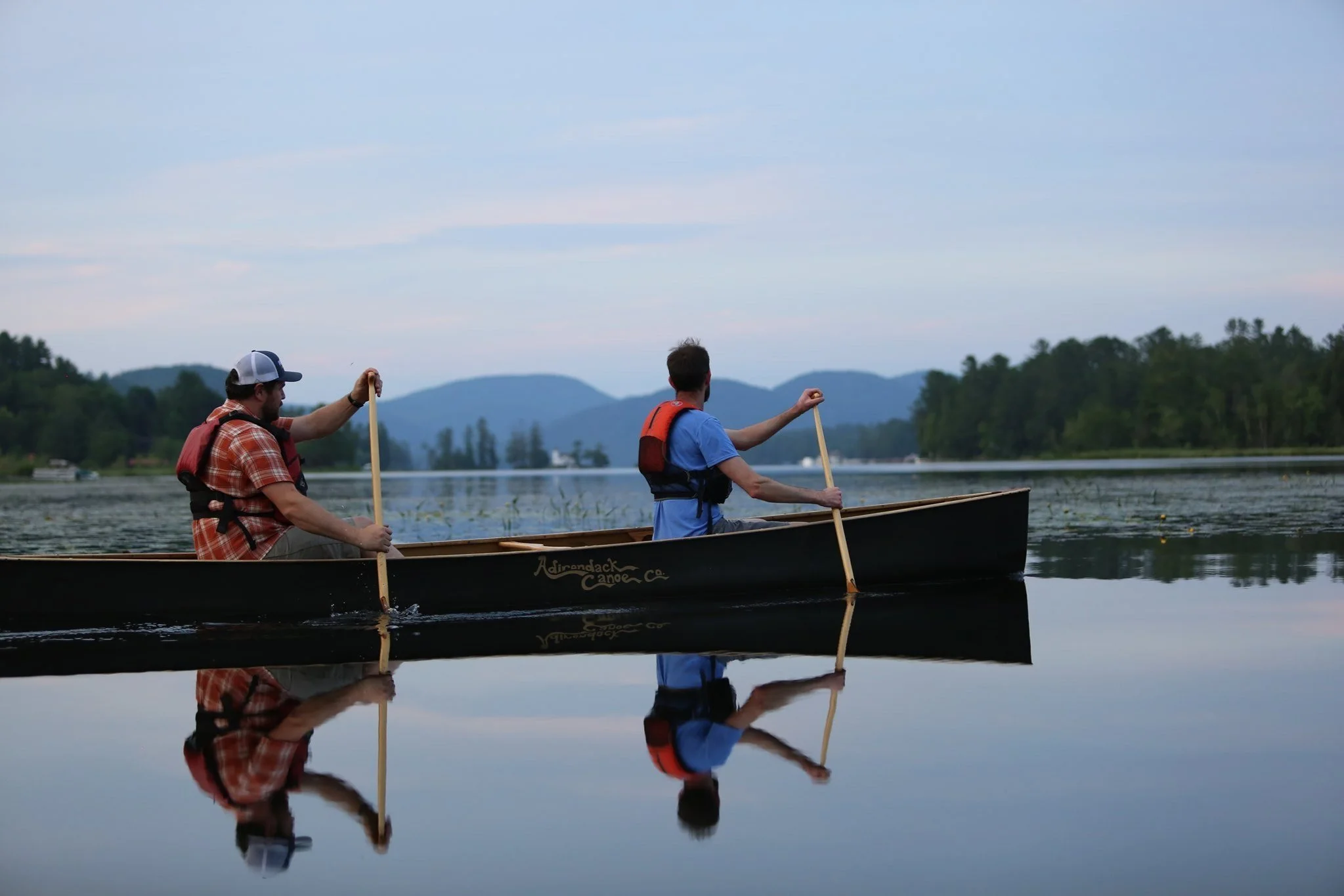 Canoers competing at the Great Brant Lake Canoe Race in the Adirondack Park.