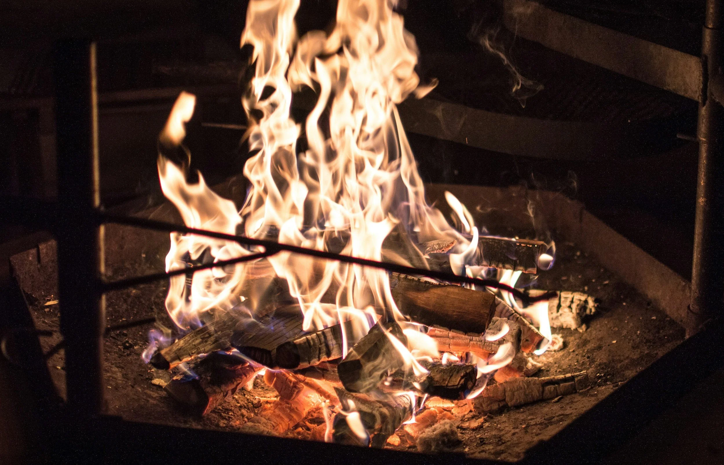 Winter bonfire like the ones at Mt. Van Hoevenberg's full moon parties in 2026.