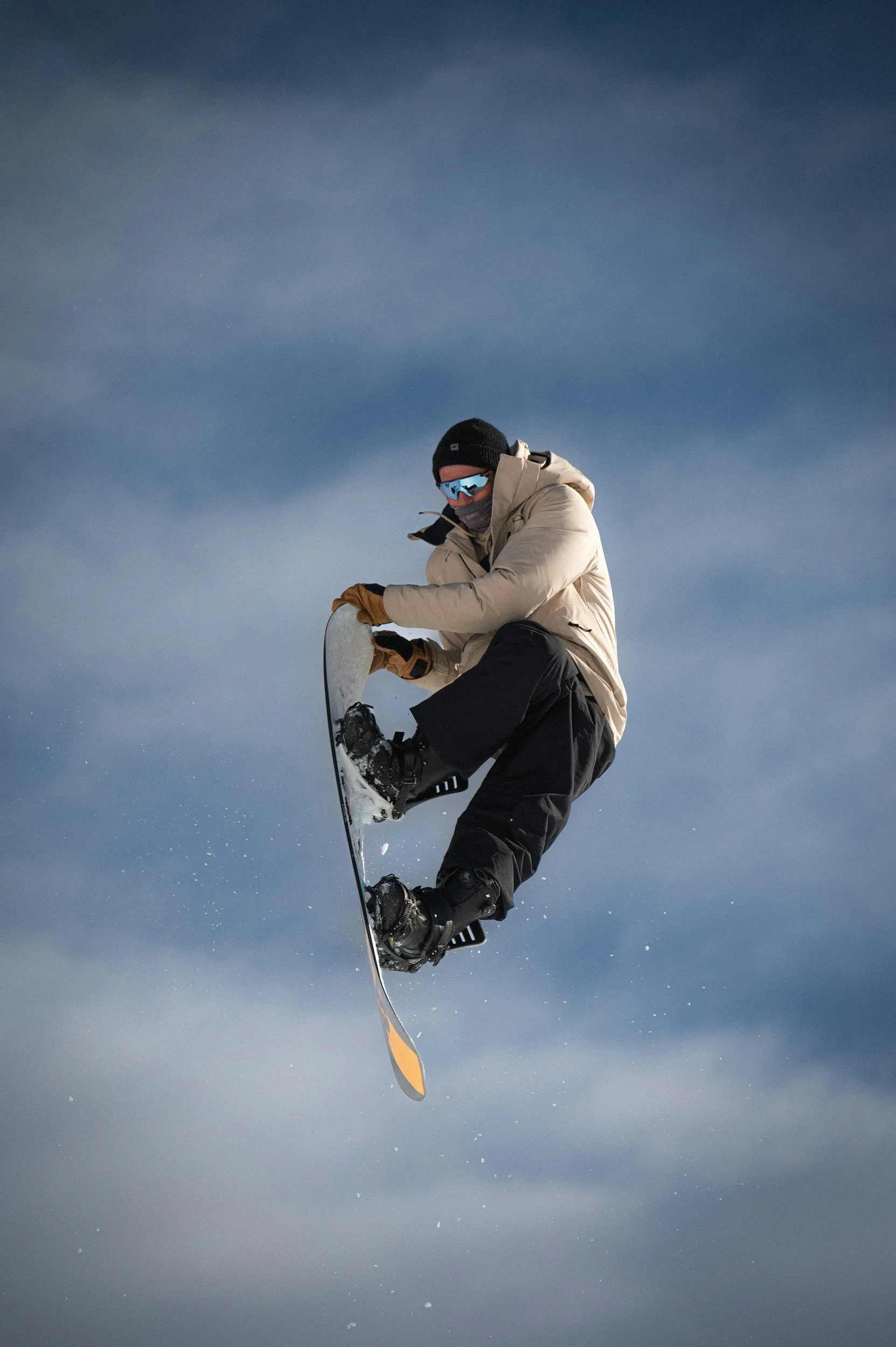 Snowboarder performing stunts.