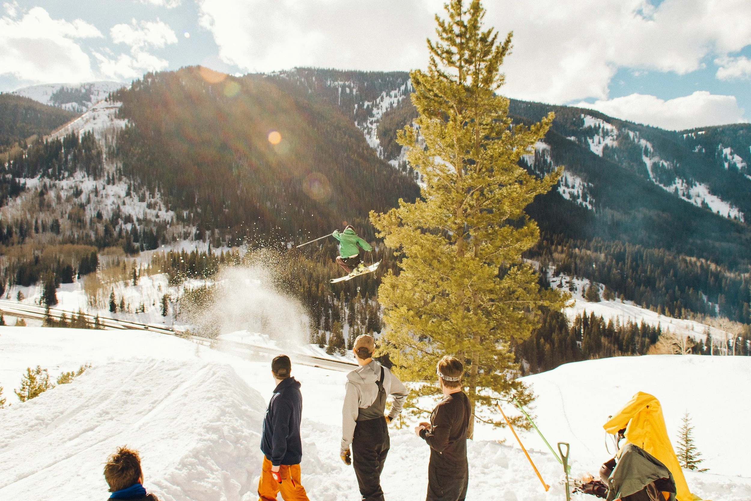Skiers and snowboarders having fun during spring skiing in the Adirondacks.
