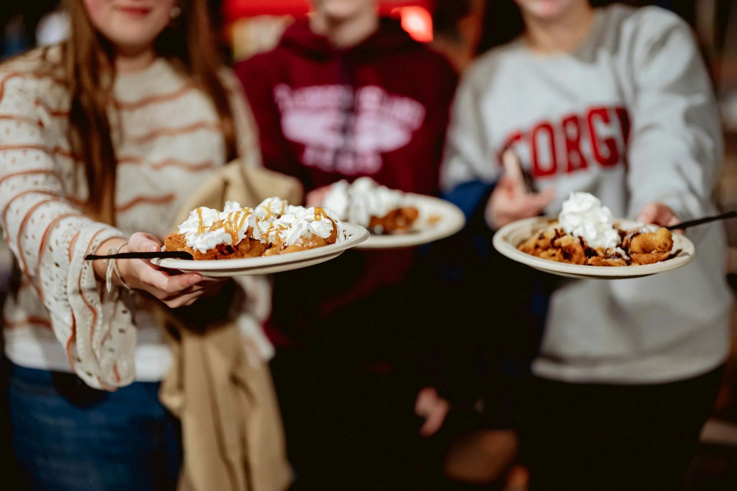 Waffles with maple syrup and whipped cream.