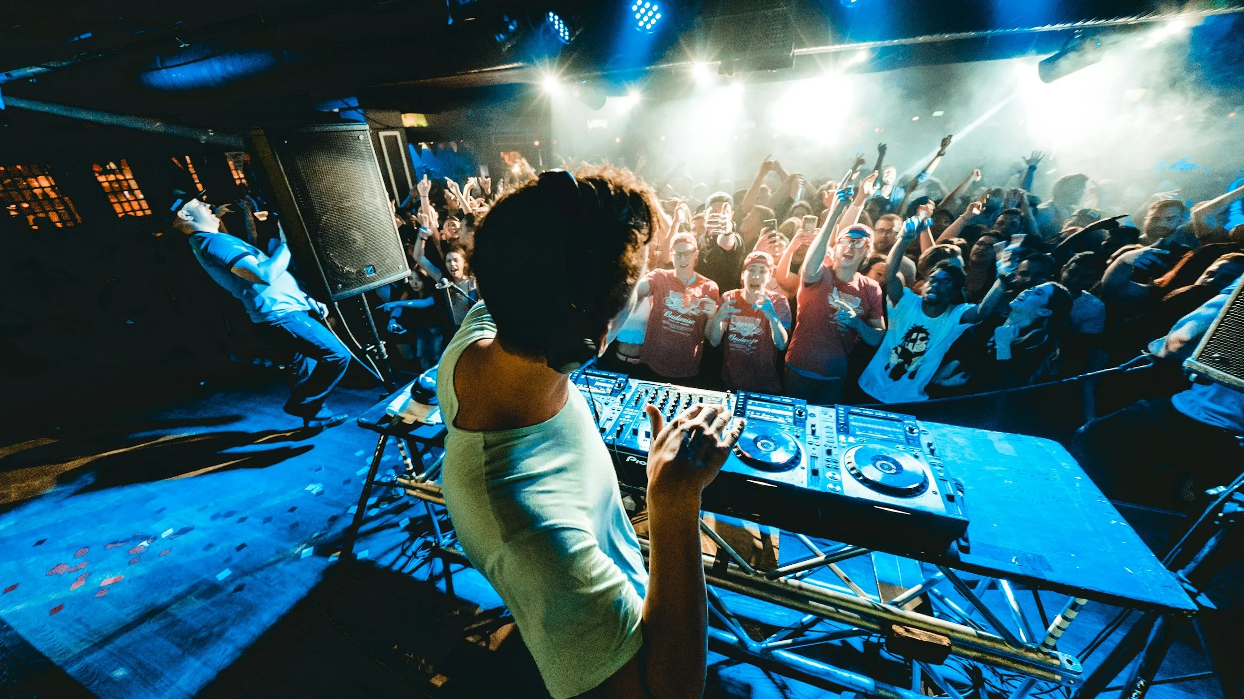 DJ responding to audience at EDM festival show like the one in Lake George.