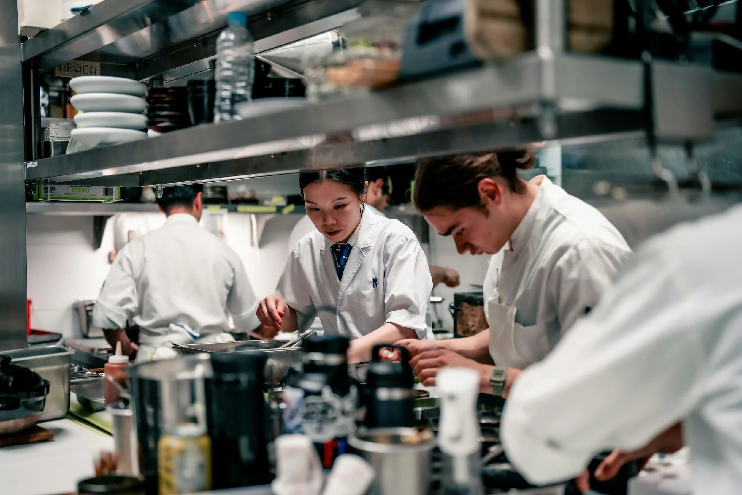 Students cooking in a culinary program like the one at Paul Smith's