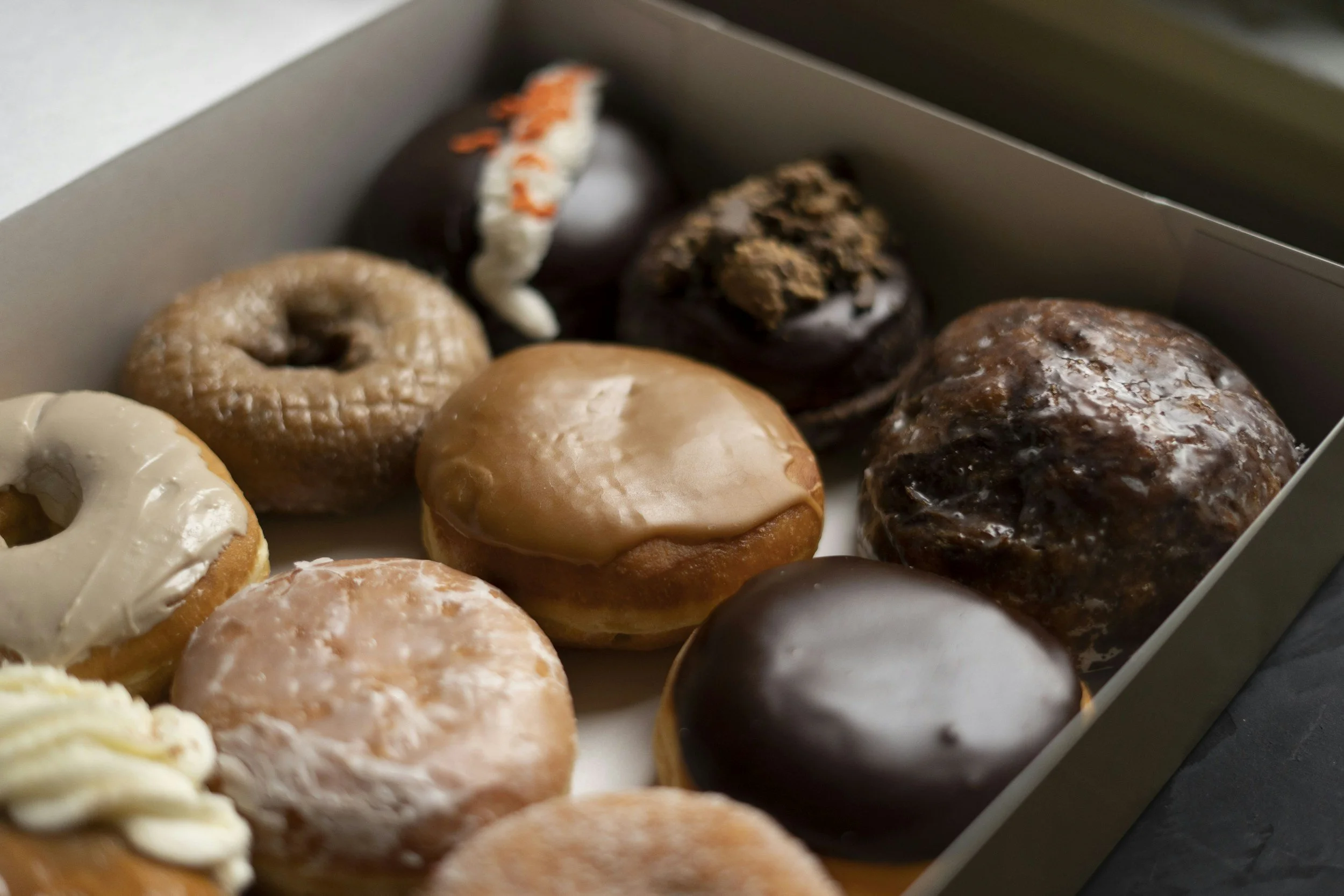 Variety of fresh donuts in a box