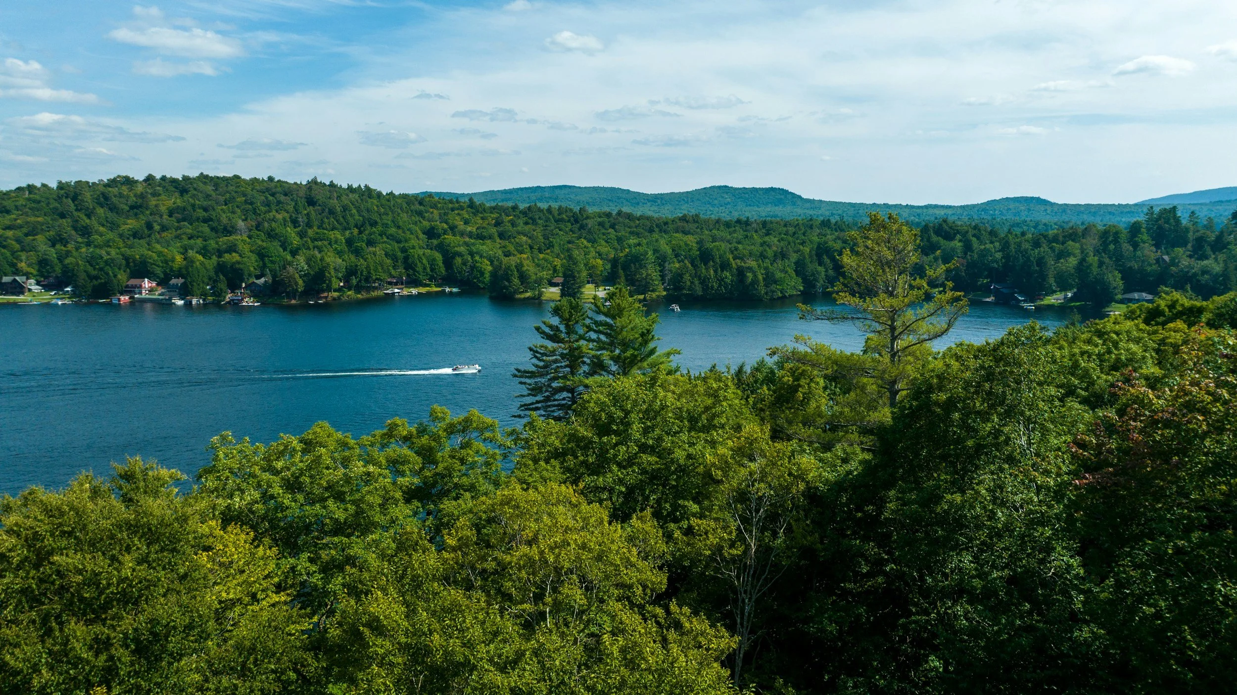 Motor boat cruising on the northern end of Lake George.