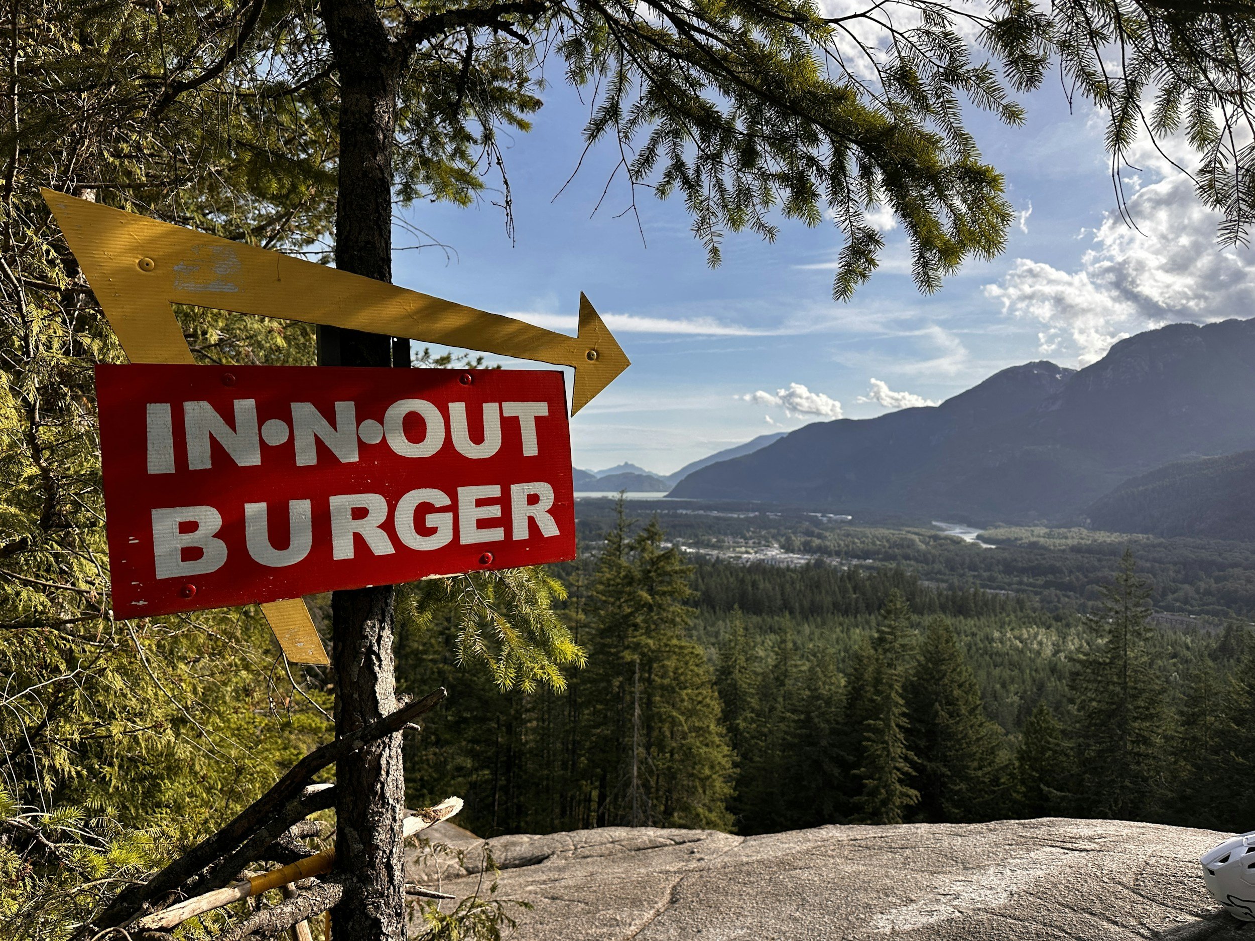sign for take out burgers in the mountains.