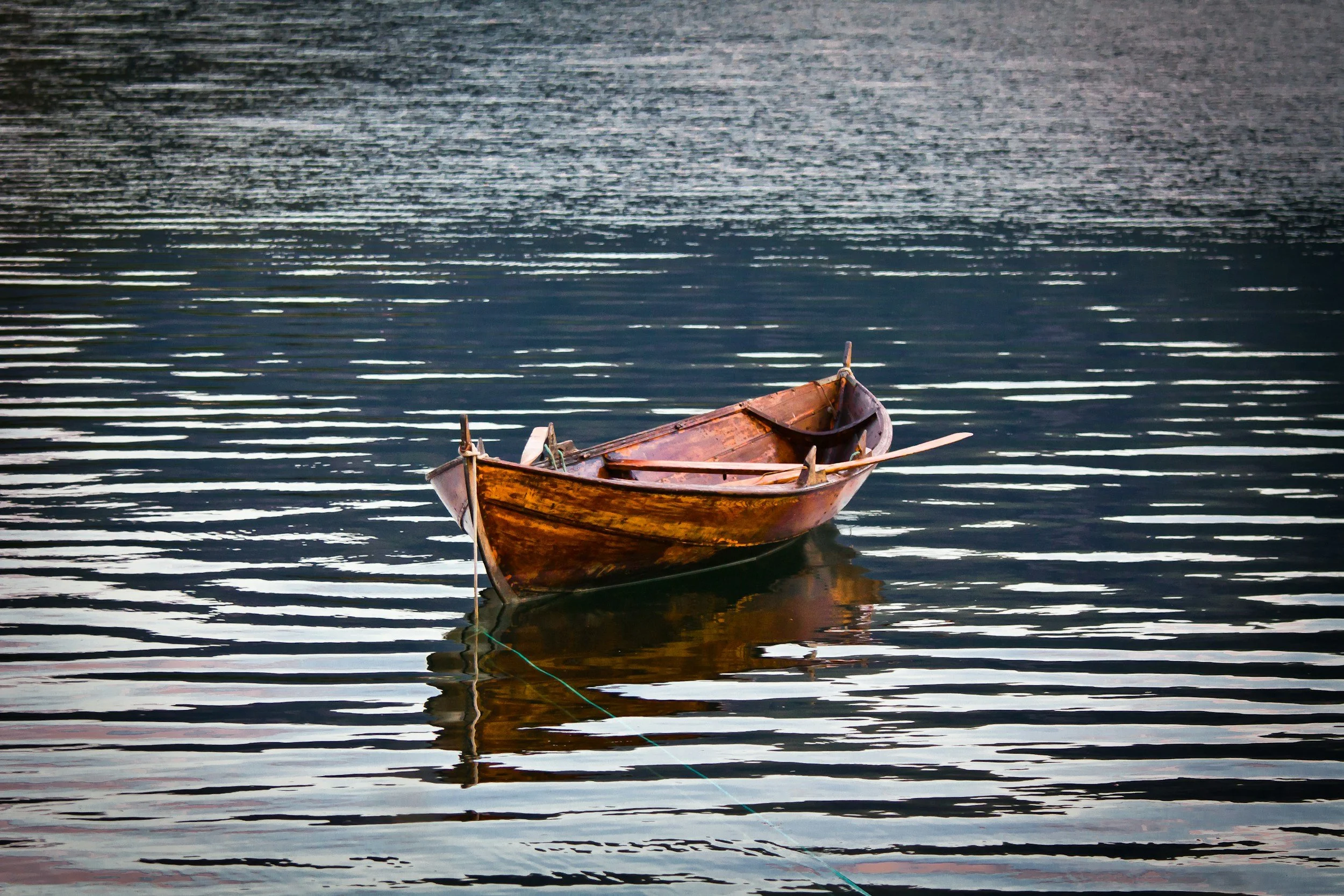 Wooden boat on lake.