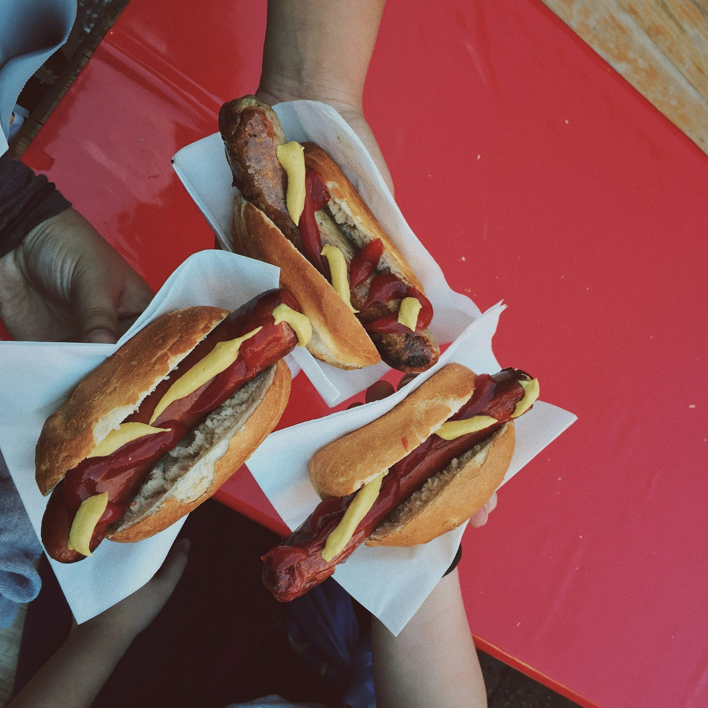 Hot dogs with ketchup and mustard.