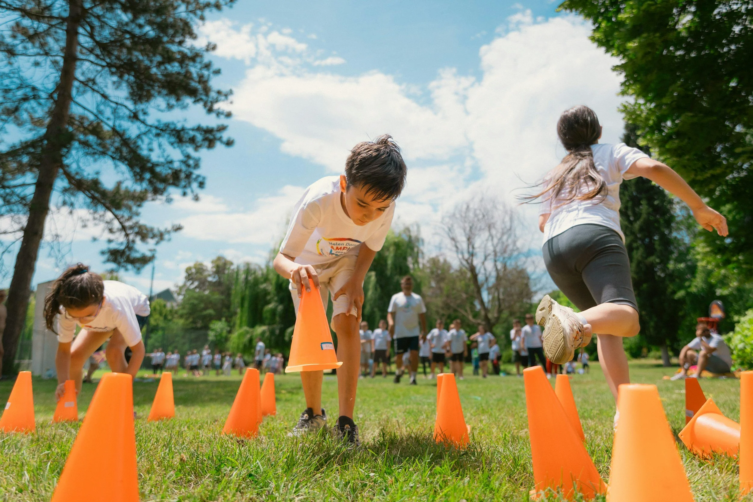 Kids racing in a relay race at field day.