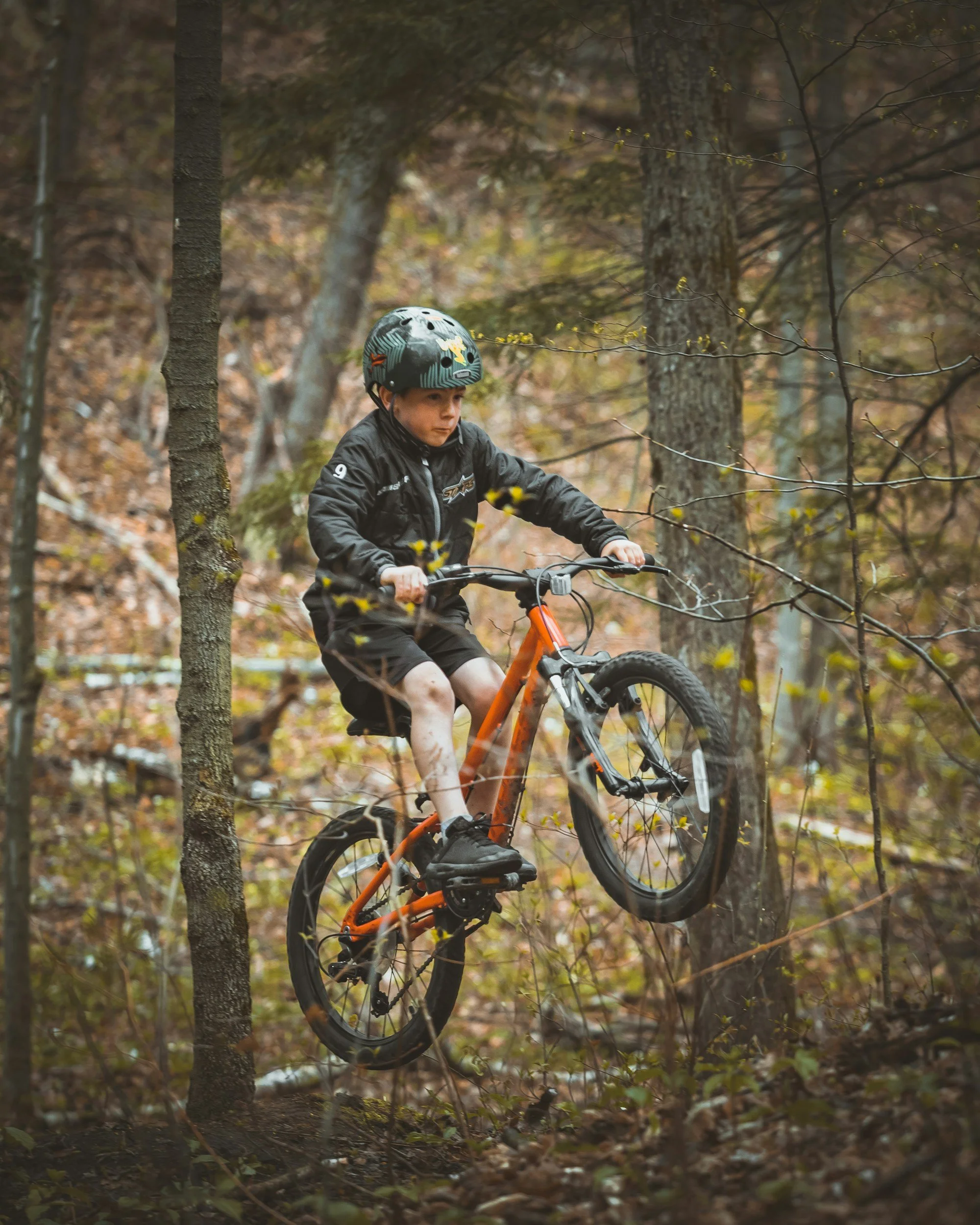 Kids mountain biking on Adirondack trails.