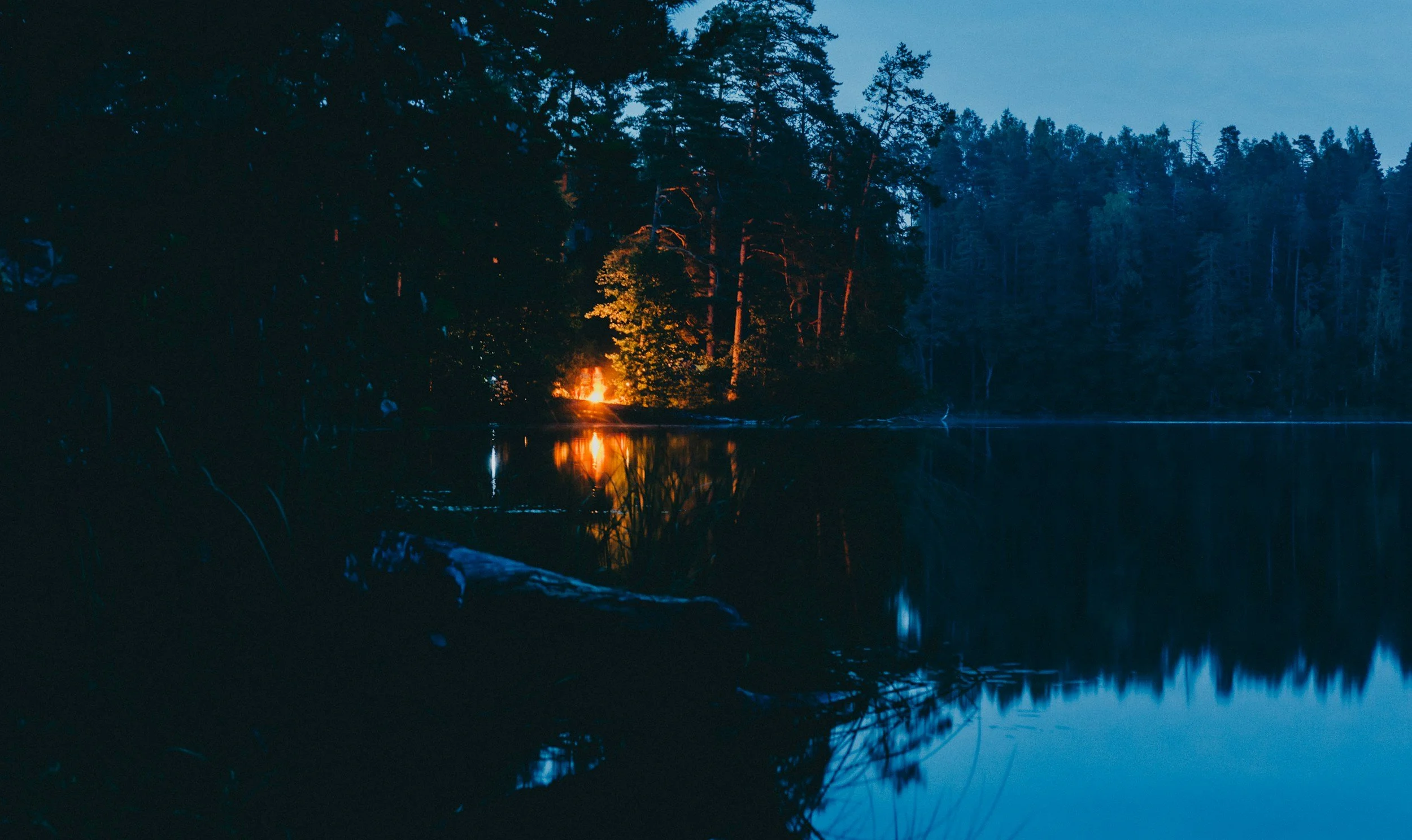 campfire on a peaceful Adirondack lake on Labor Day weekend.