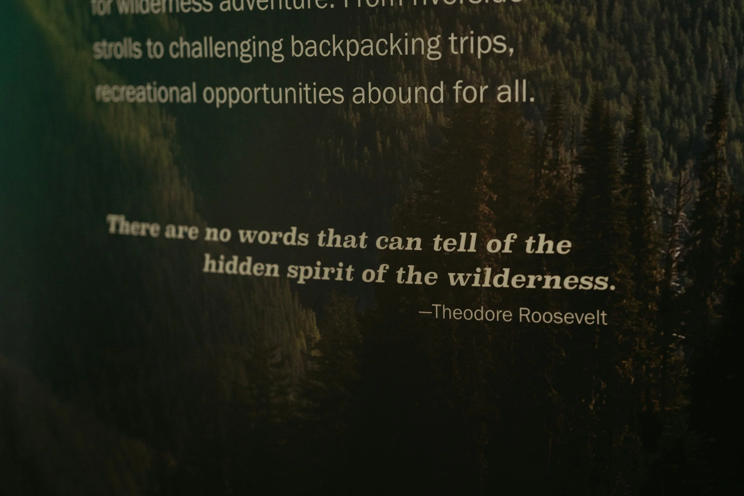 Plaque inscribed with Theodore Roosevelt quote "There are no words that can tell of the hidden spirit of the wilderness."
