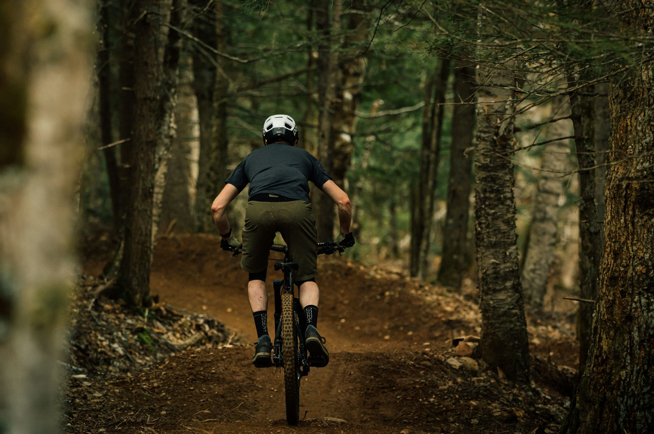 Cyclist competing in a mountain bike tournament in Lake Placid in the Adirondack Mountains.