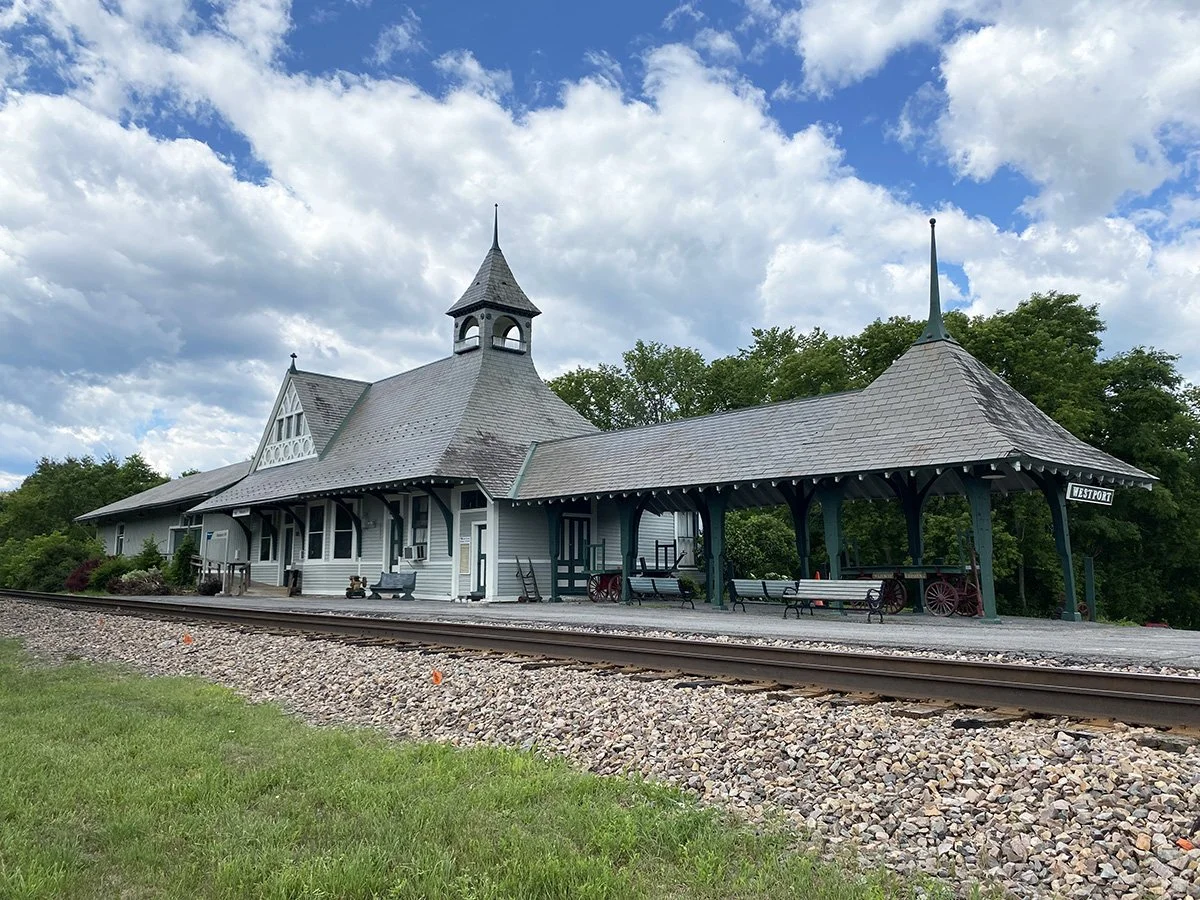 Westport's Depot Theatre beside train tracks.