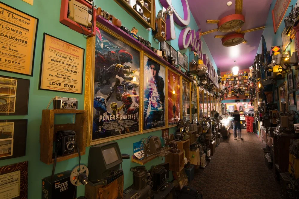 Lobby of Old Forge's Strand Theater and it's collection of movie memorabilia and vintage equipment.