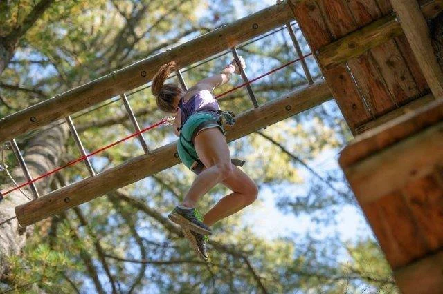Adirondack Extreme monkey bars in Bolton Landing adventure course.