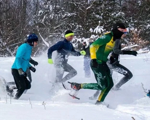 Snowshoers racin in Saranac Lake's cock-a-doodle Shoe over Martin Luther King (MLK) Weekend