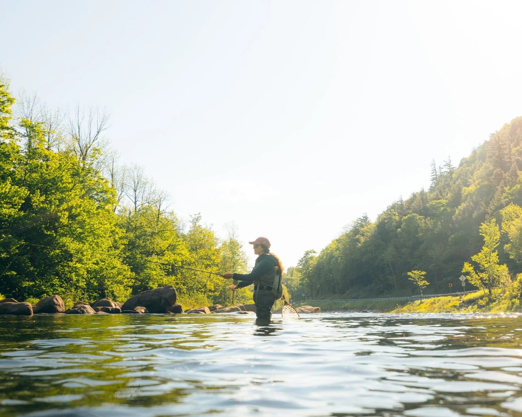 Competitor in the Ausable two-fly challenge in a river in the Adirondacks.