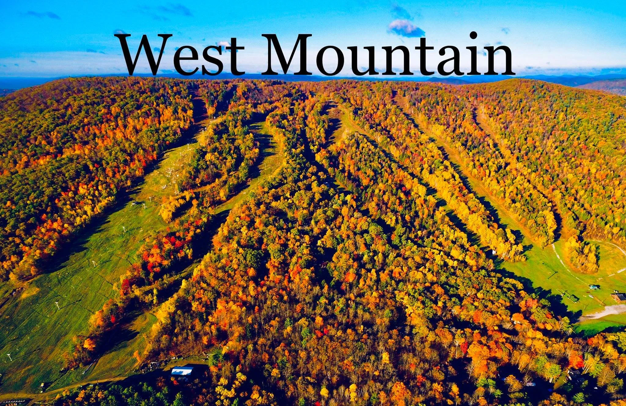 Vibrant fall leaves covering West Mountsin in Queensbury, NY.