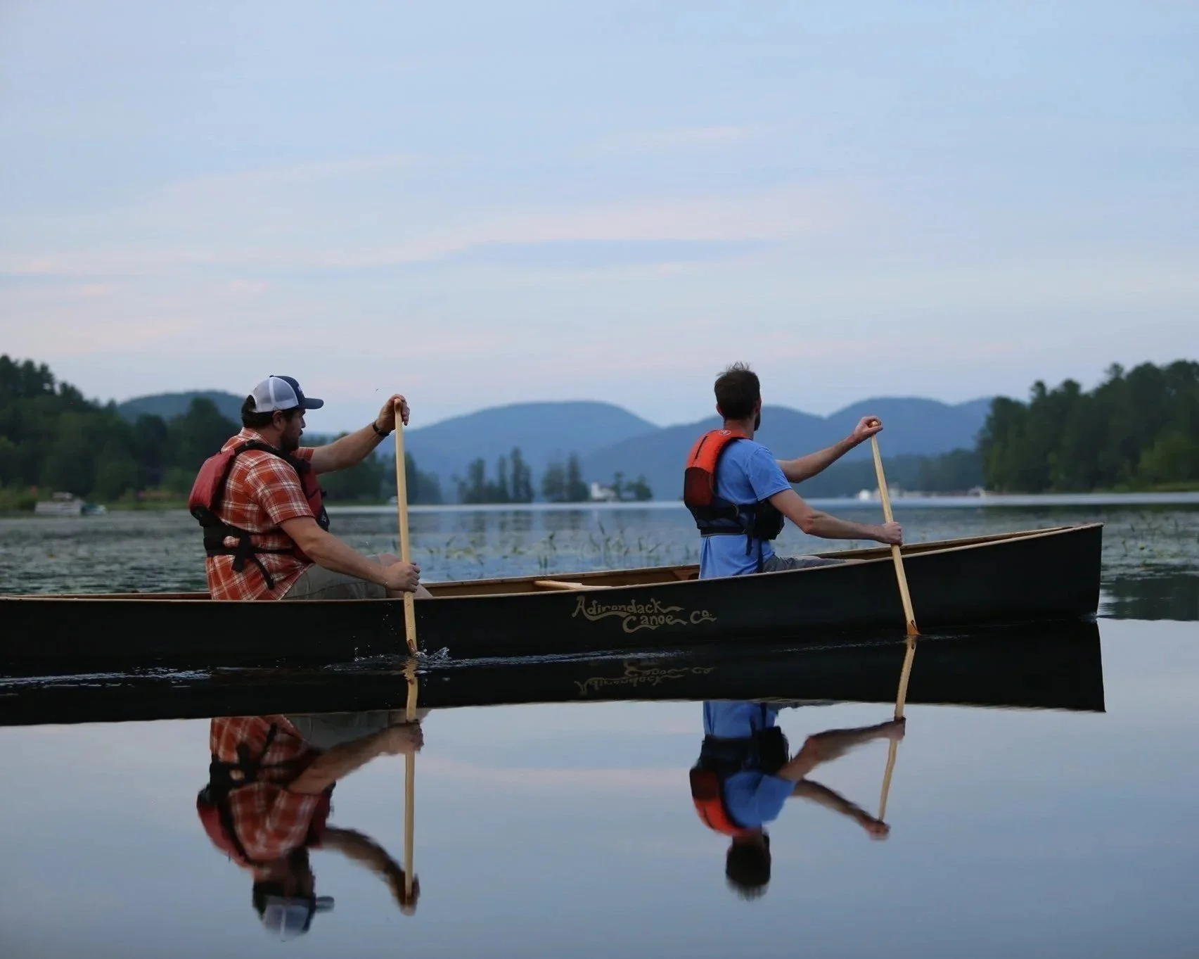 Paddlers in a canoe competing in the Grant Brank Lake Canoe Race.