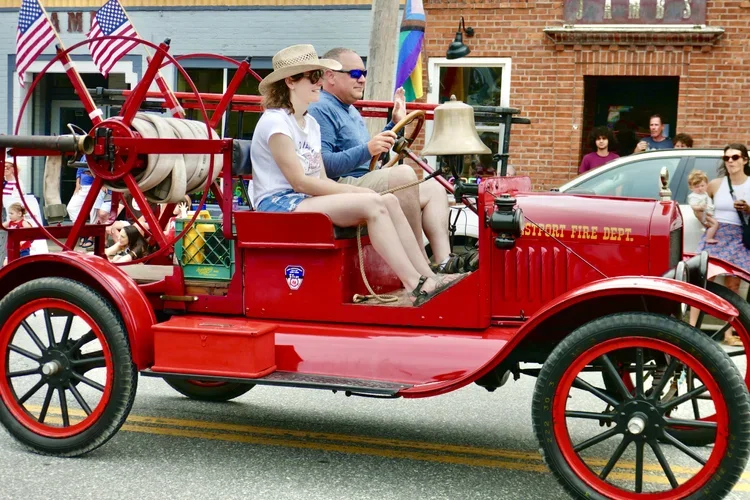 Antique firetruck rolls through Westport's 4th of July Parade.