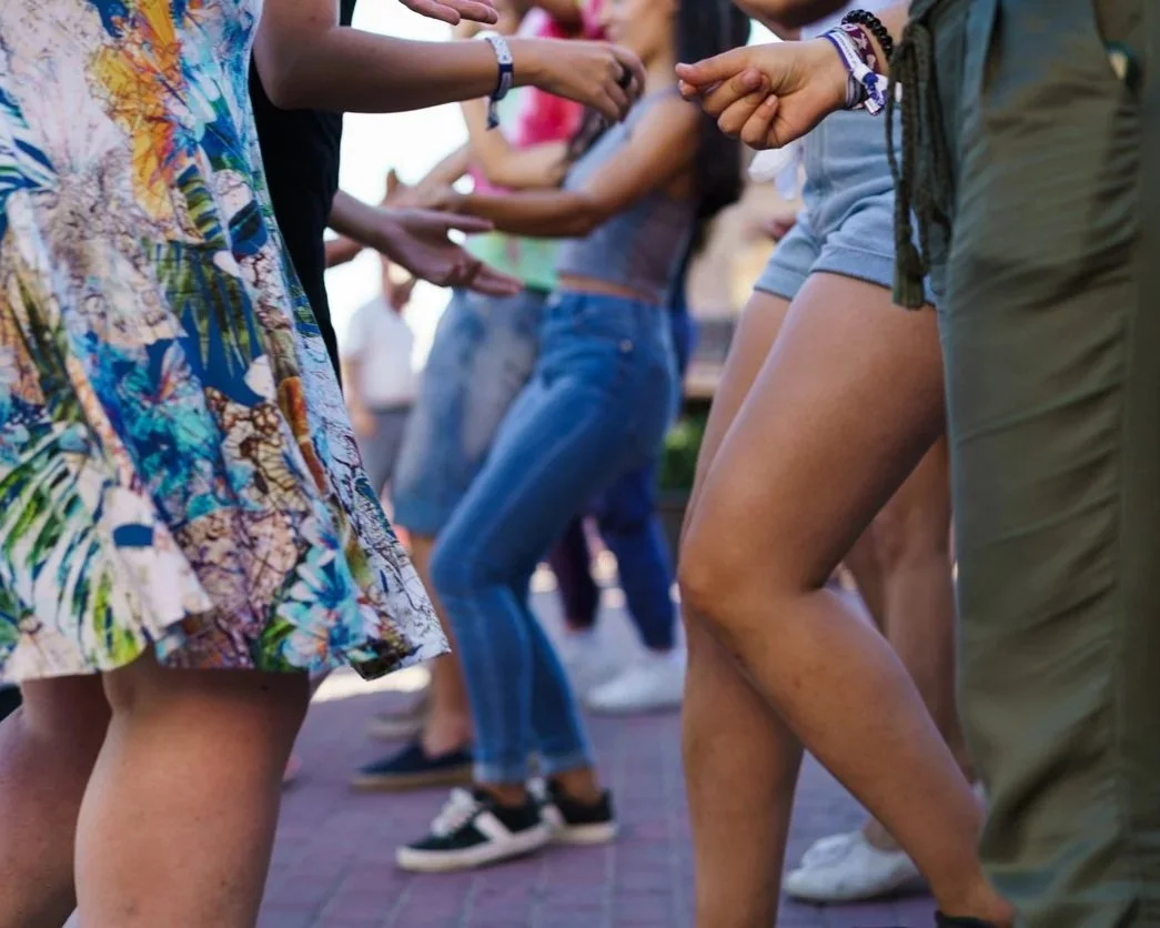 People dancing in the street in Schroon Lake on Labor Day Weekend.