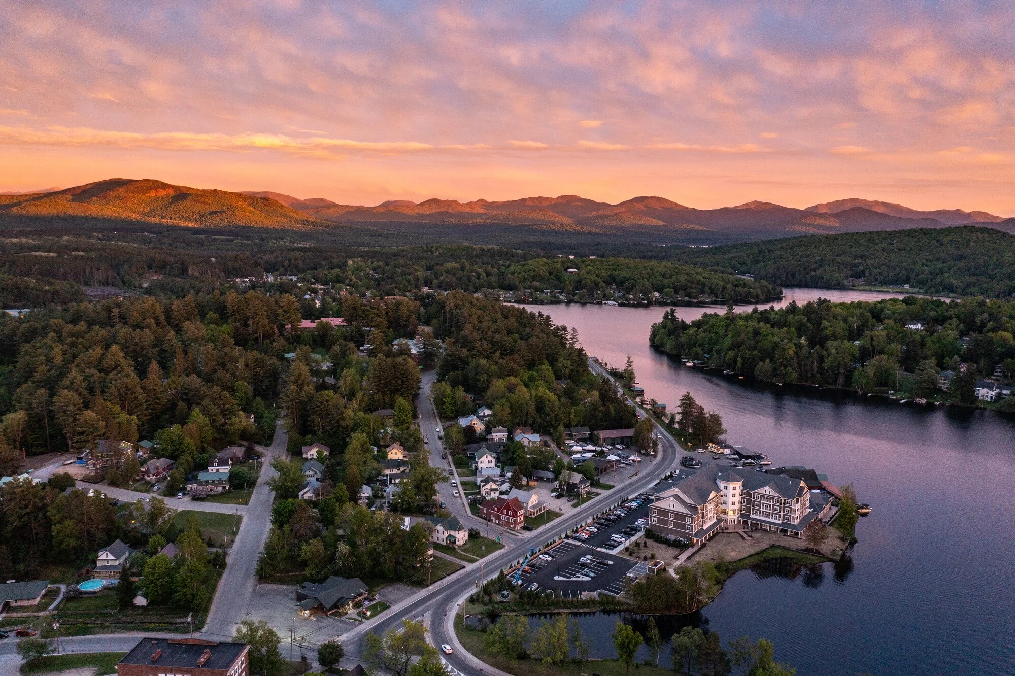 Drone image of Saranac Lake and Lake Flower at sunset in summer.