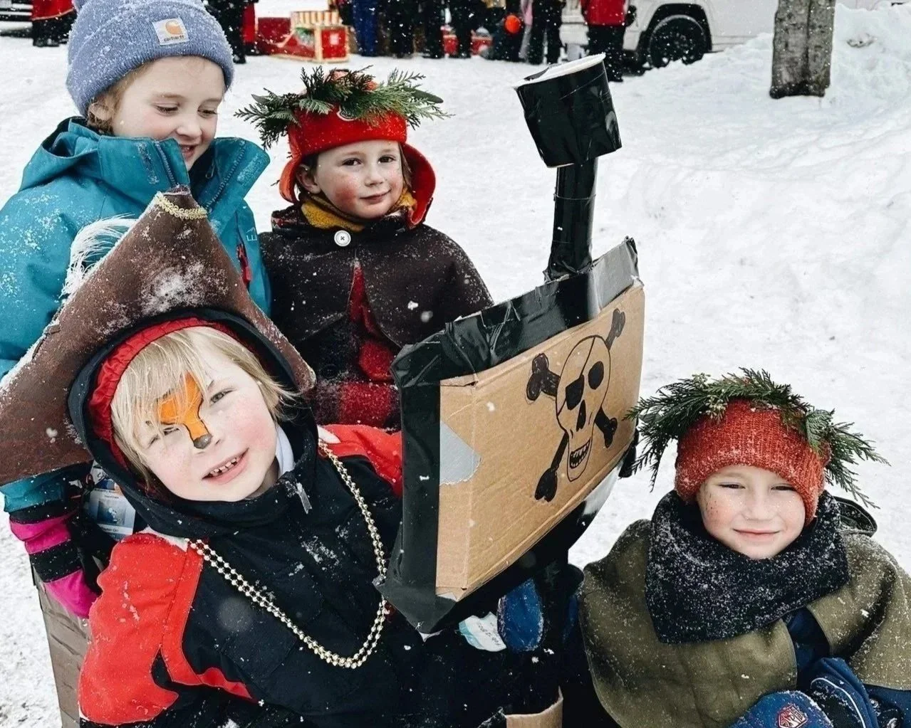 Cardboard sled racers at Inlet's Frozen Fire and Lights on February 28, 2026