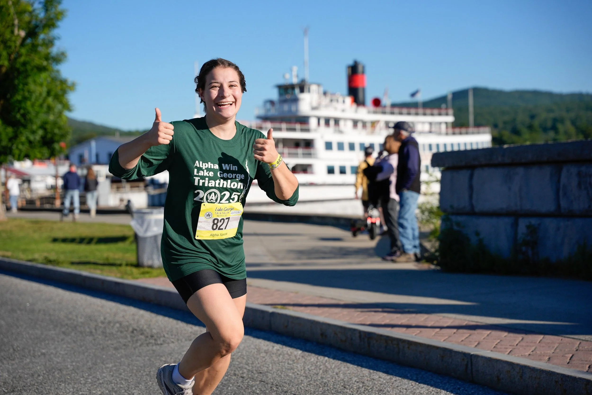 Woman running in a triathlon on Beach Road in Lake George.