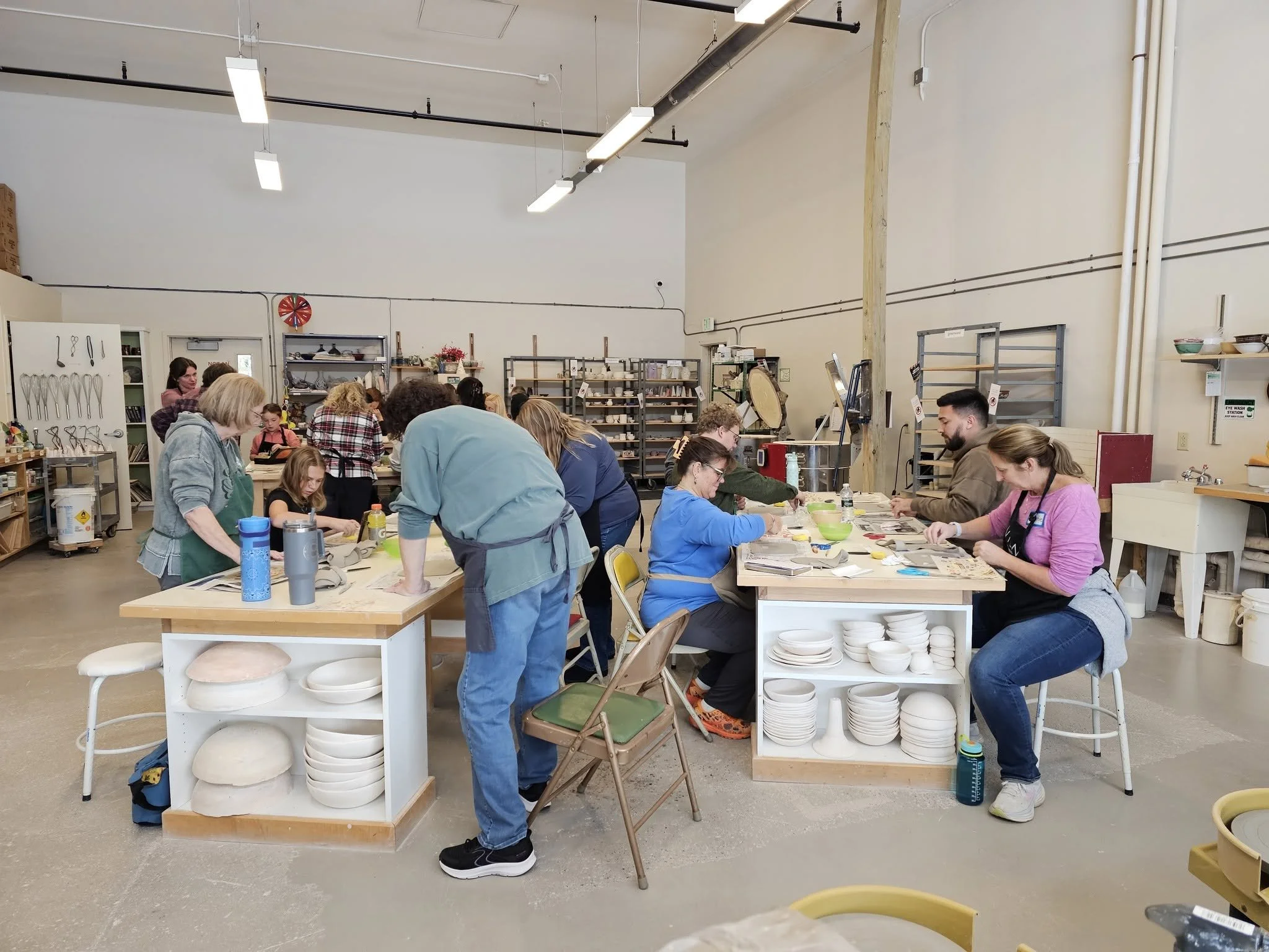 People participating in View Arts Center hands-on pottery workshop.