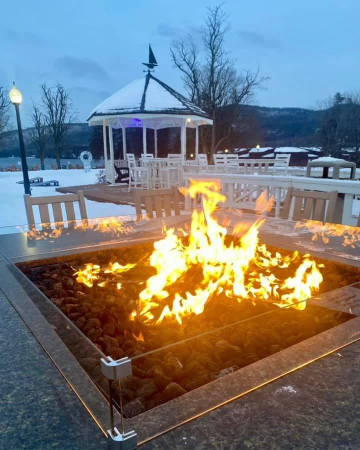 Fire pit blazing on Lake George's Fort William Henry hotel during the Polar Ice Bar.