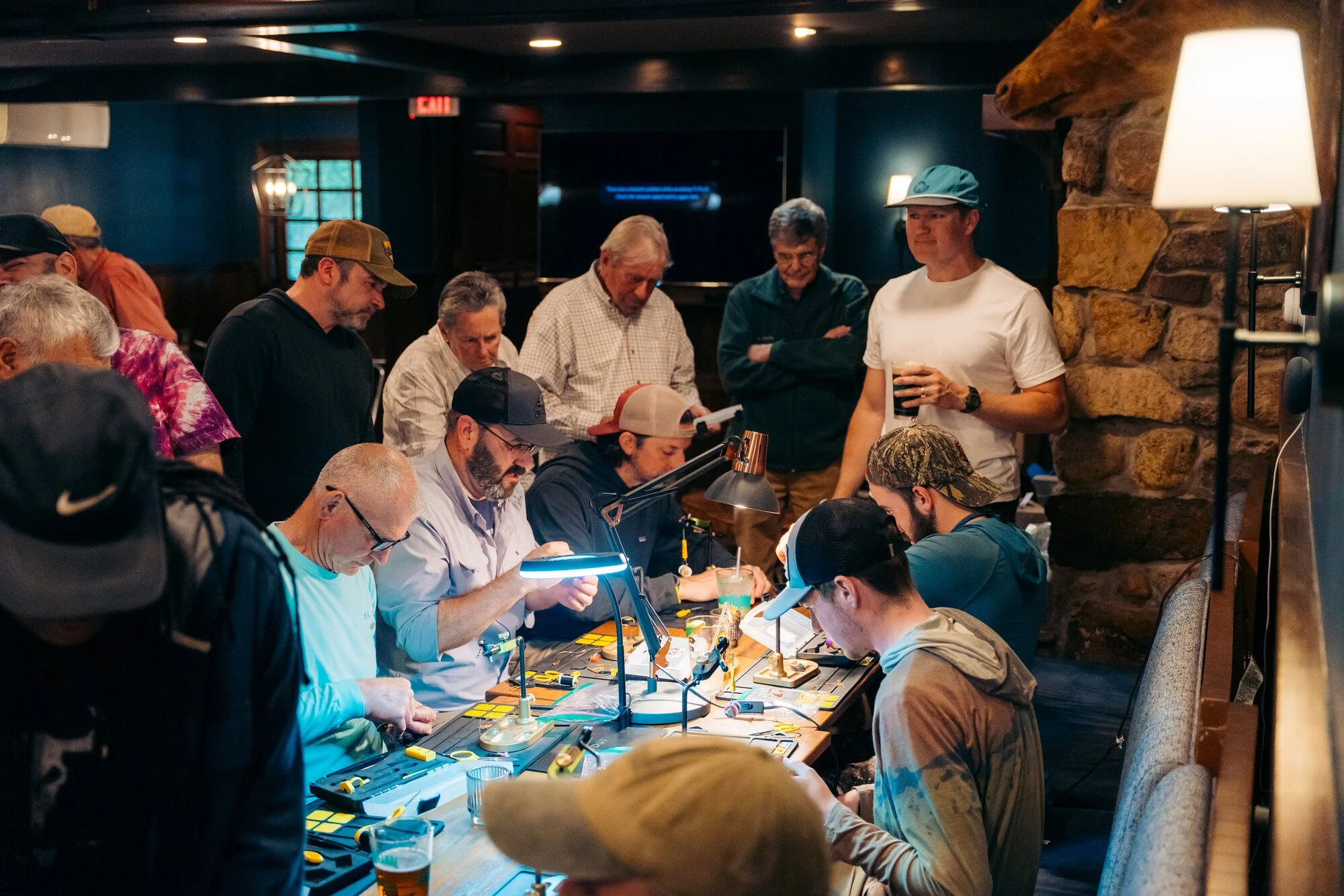 Ausable river two-fly challenge fly fishing competitor tying flies at the hungry trout fly shop in Wilmington.